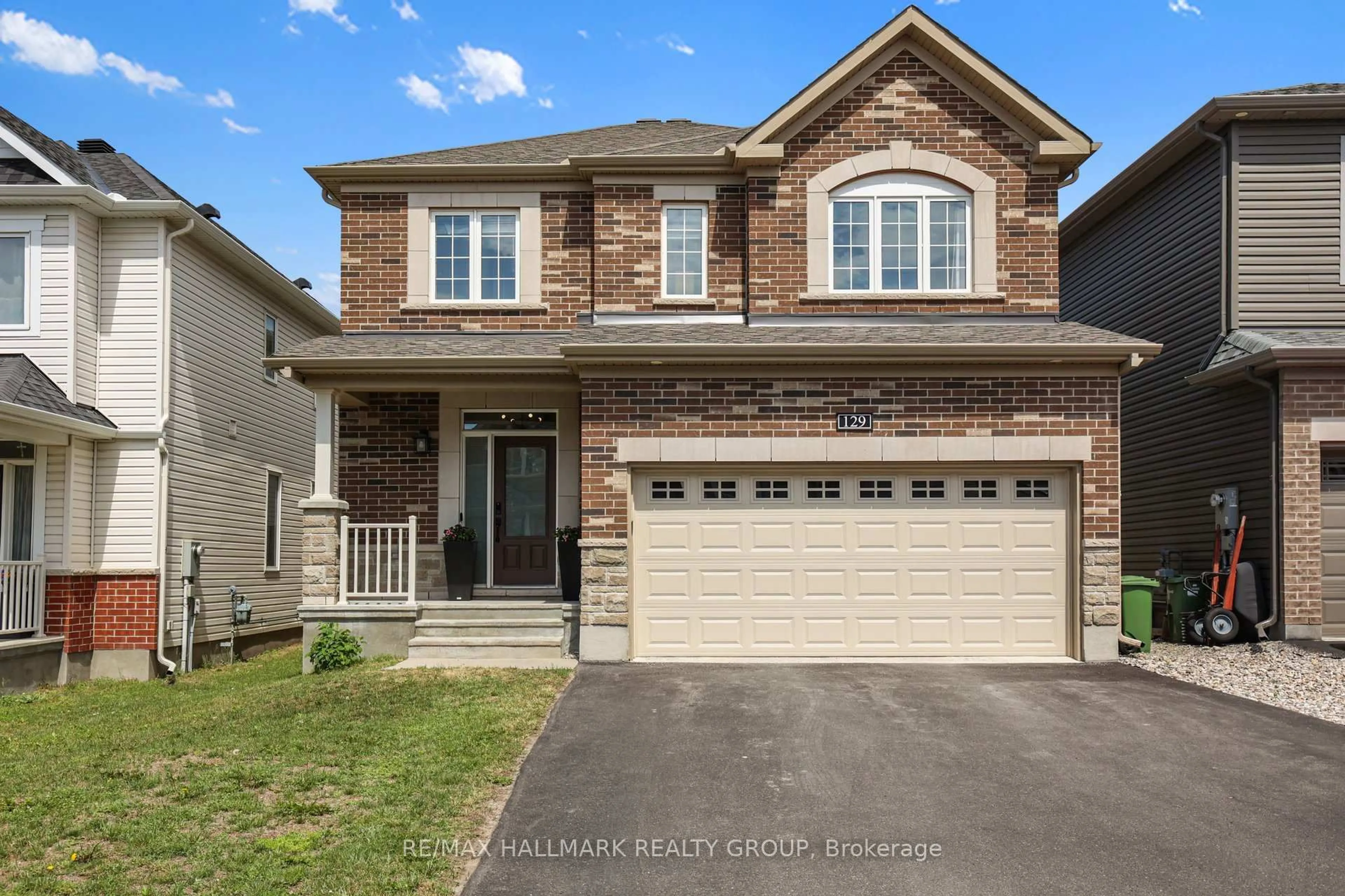 Home with brick exterior material, street for 129 Robin Easey Ave, Ottawa Ontario K2J 6V4