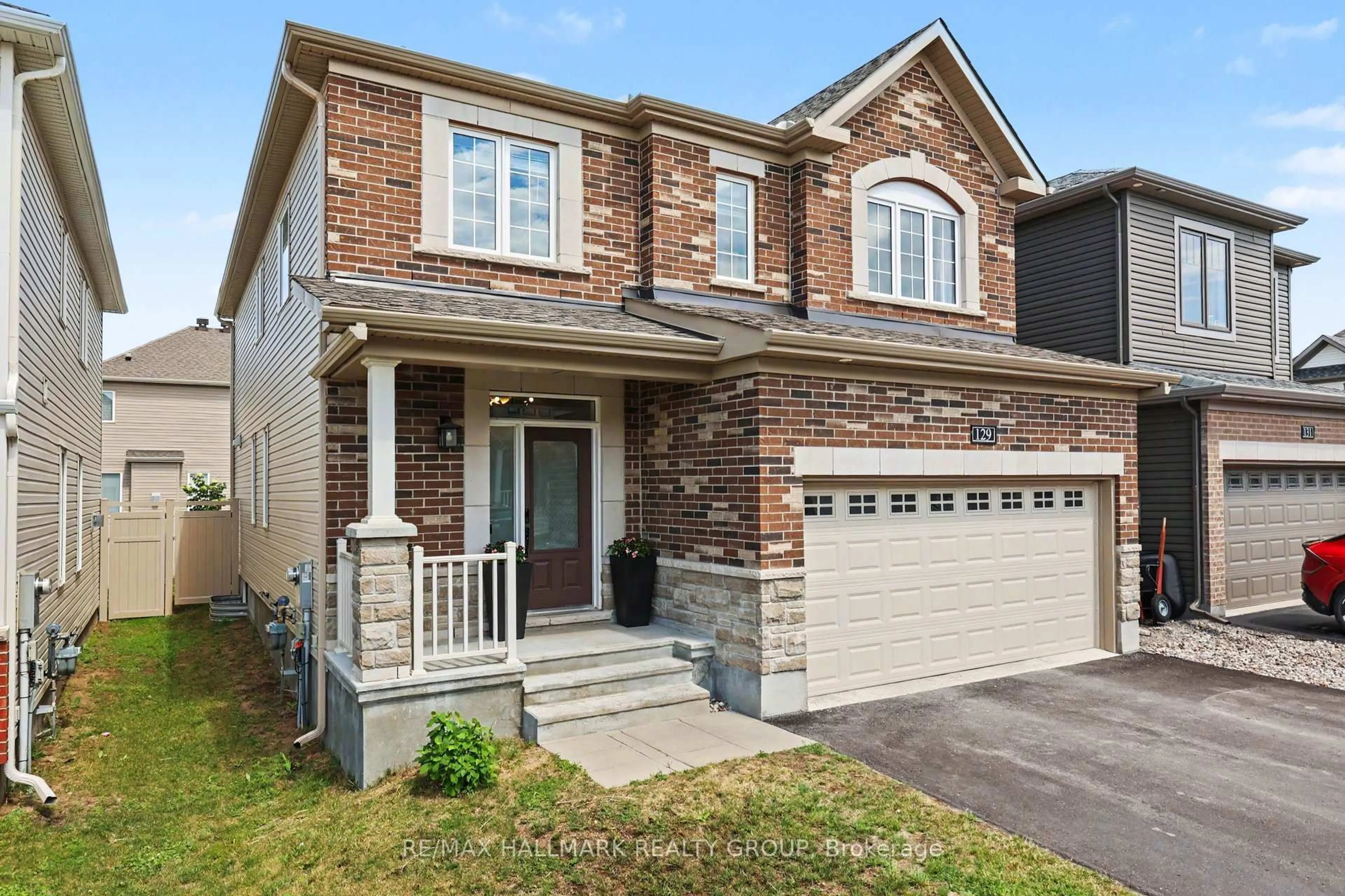 Home with brick exterior material, street for 129 Robin Easey Ave, Ottawa Ontario K2J 6V4