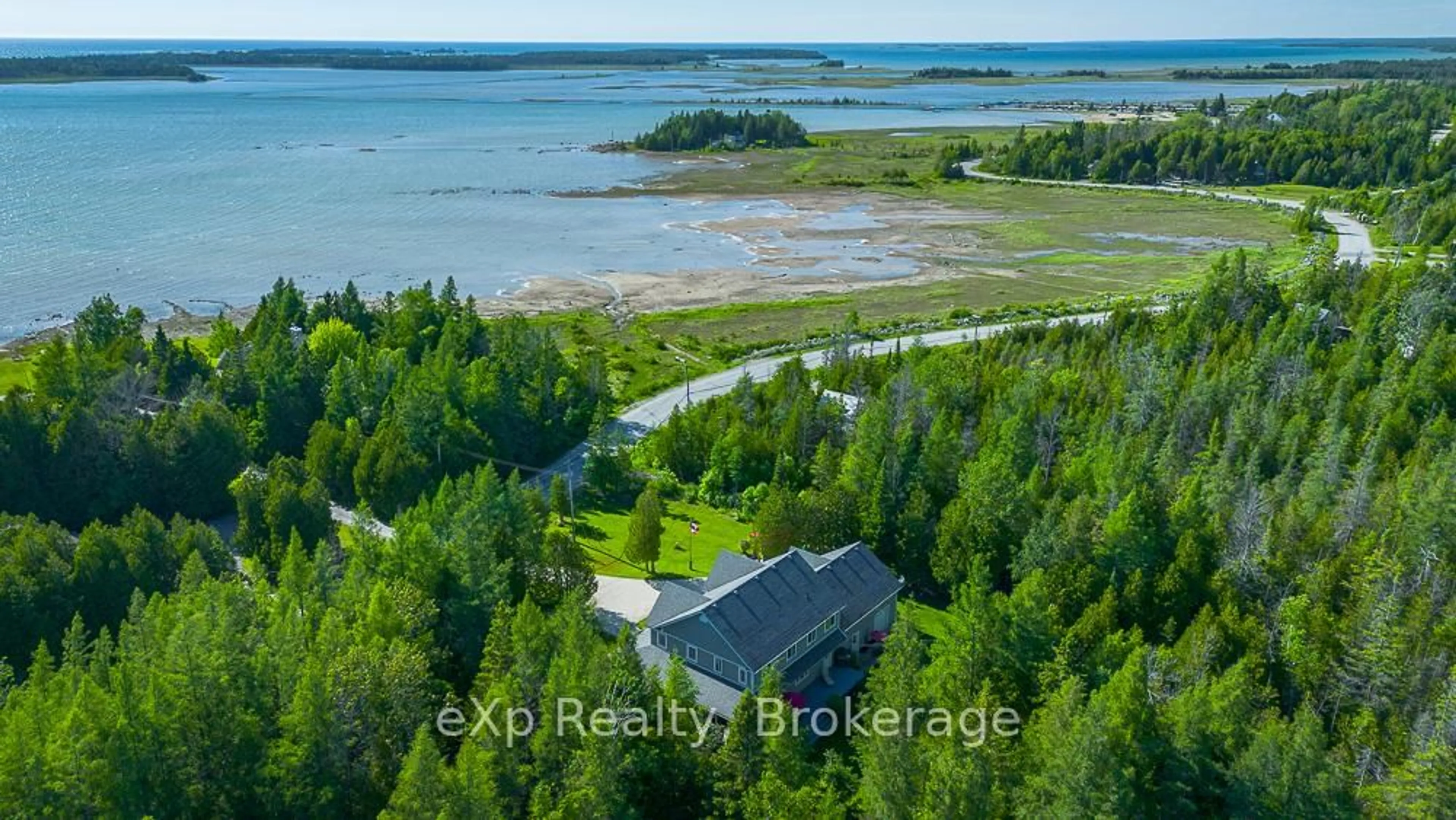 A pic from outside/outdoor area/front of a property/back of a property/a pic from drone, water/lake/river/ocean view for 141 Bay St, South Bruce Peninsula Ontario N0H 2T0
