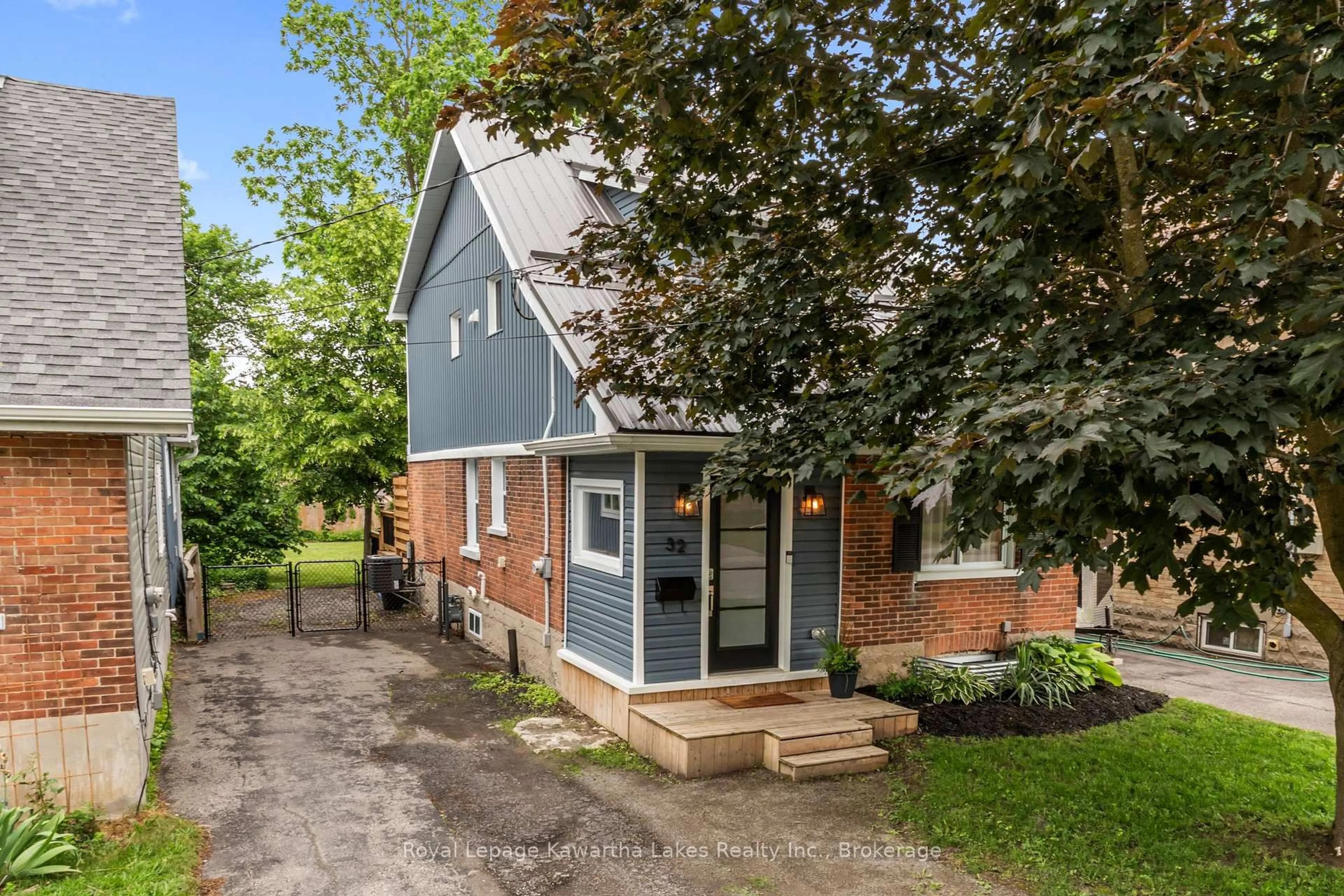 Home with brick exterior material, street for 32 Simcoe St, Kawartha Lakes Ontario K9V 2G4