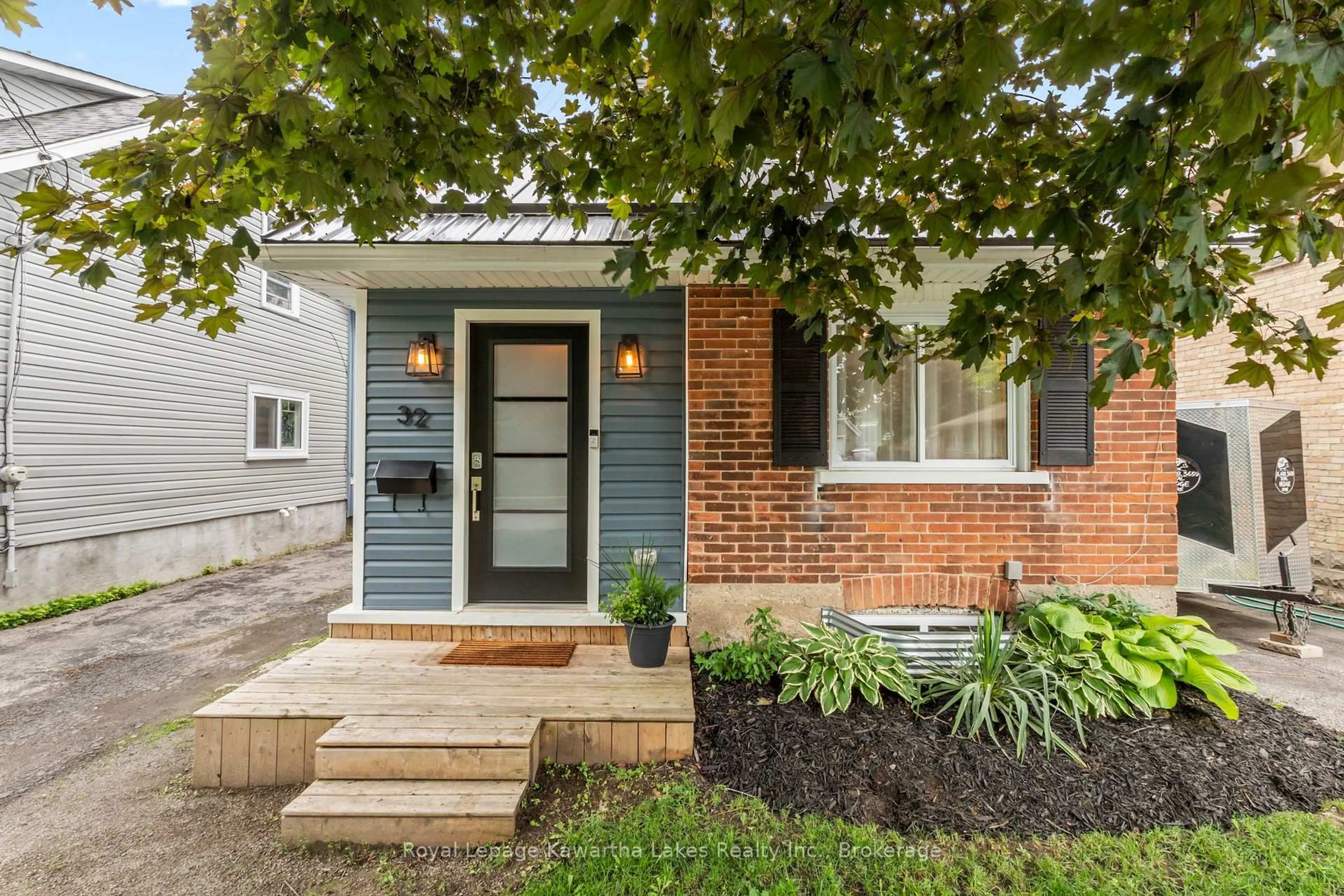 Home with brick exterior material, street for 32 Simcoe St, Kawartha Lakes Ontario K9V 2G4
