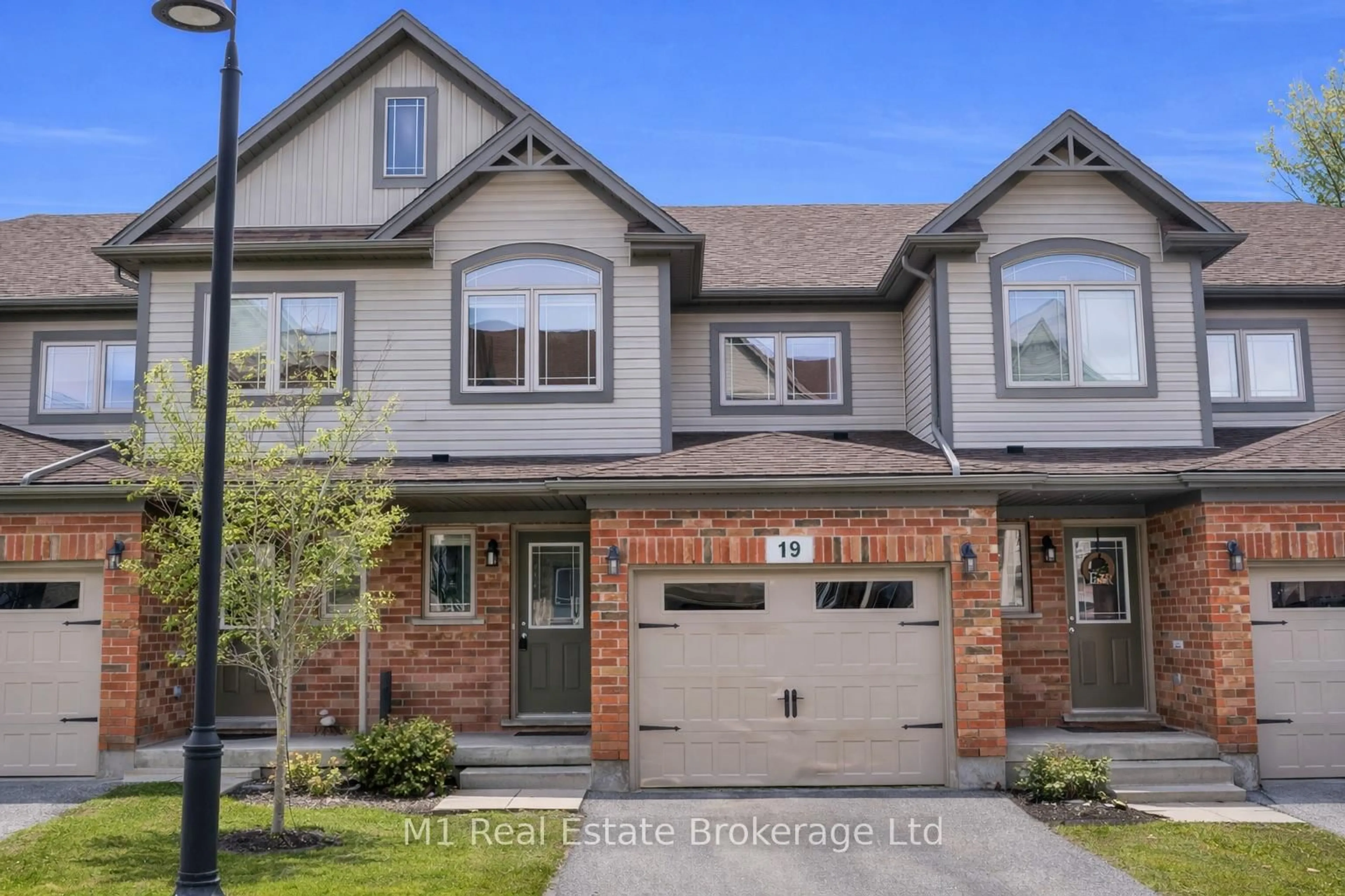 Home with brick exterior material, street for 66 Eastview Rd #19, Guelph Ontario N1E 0N1