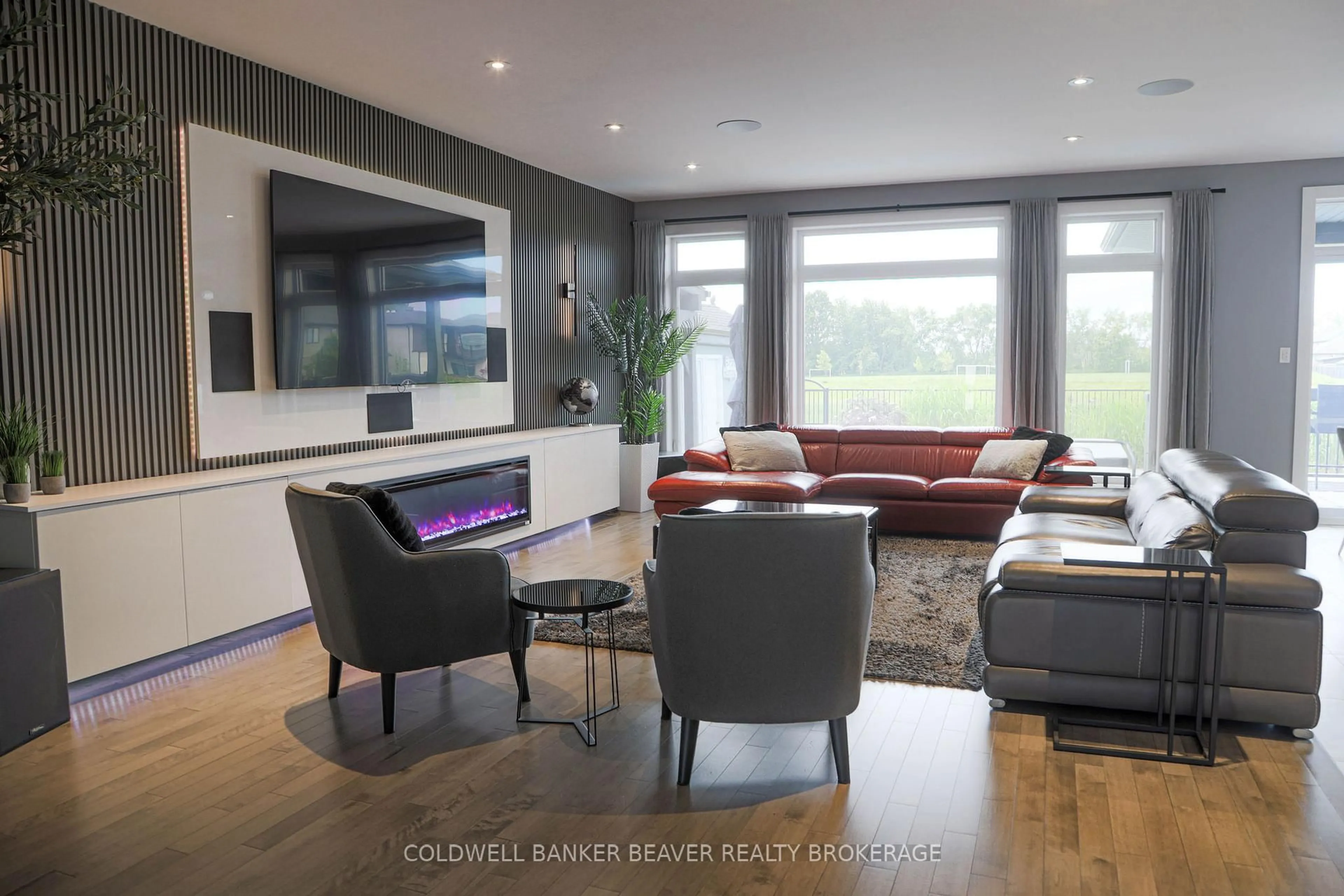 Living room with furniture, wood/laminate floor for 2173 Bakervilla St, London South Ontario N6P 0E5