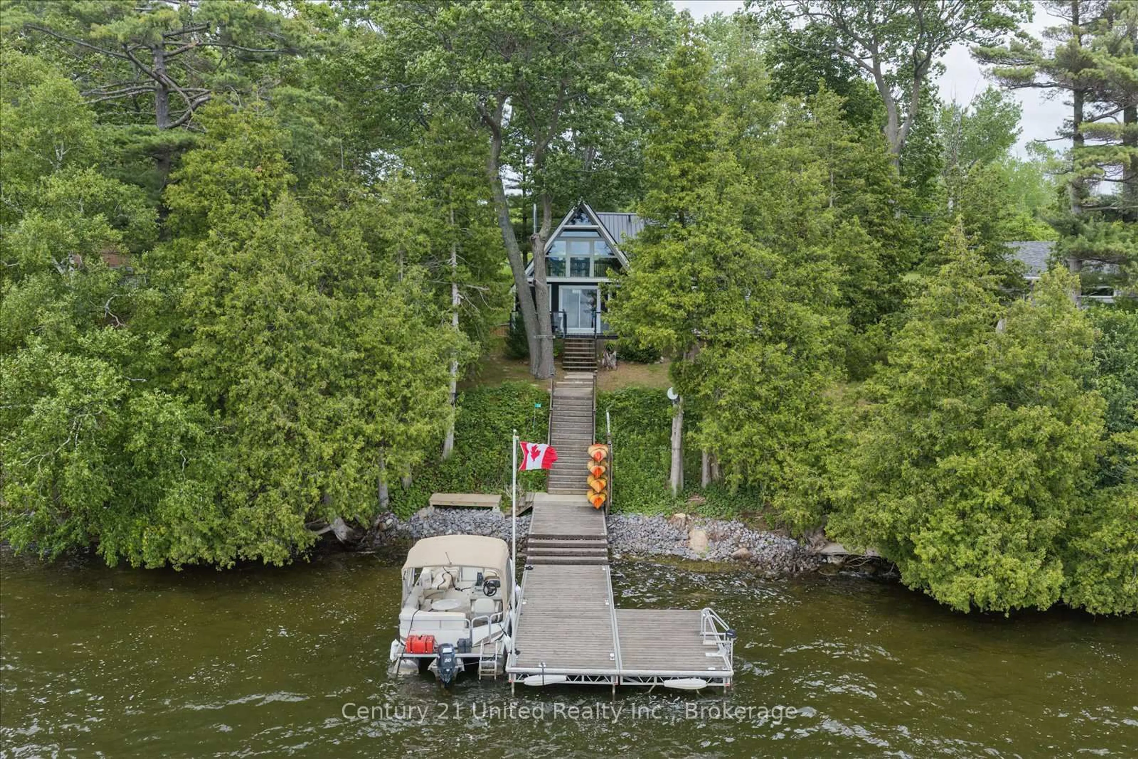 A pic from outside/outdoor area/front of a property/back of a property/a pic from drone, water/lake/river/ocean view for 54 Cow Island, Otonabee-South Monaghan Ontario K0L 1B0