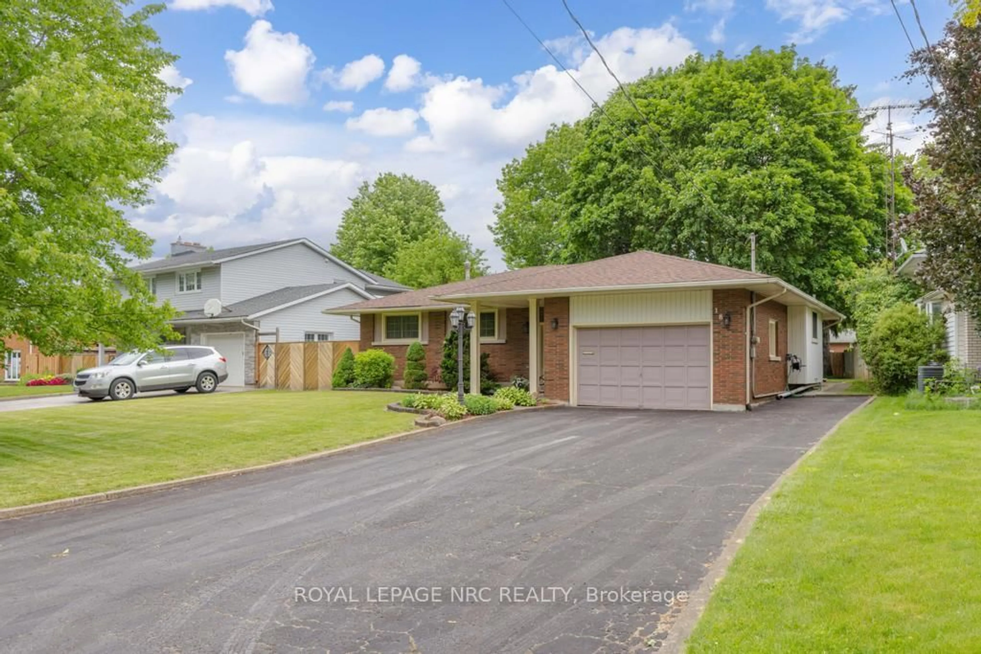 Home with vinyl exterior material, street for 18 Cartier Dr, St. Catharines Ontario L2M 2E6