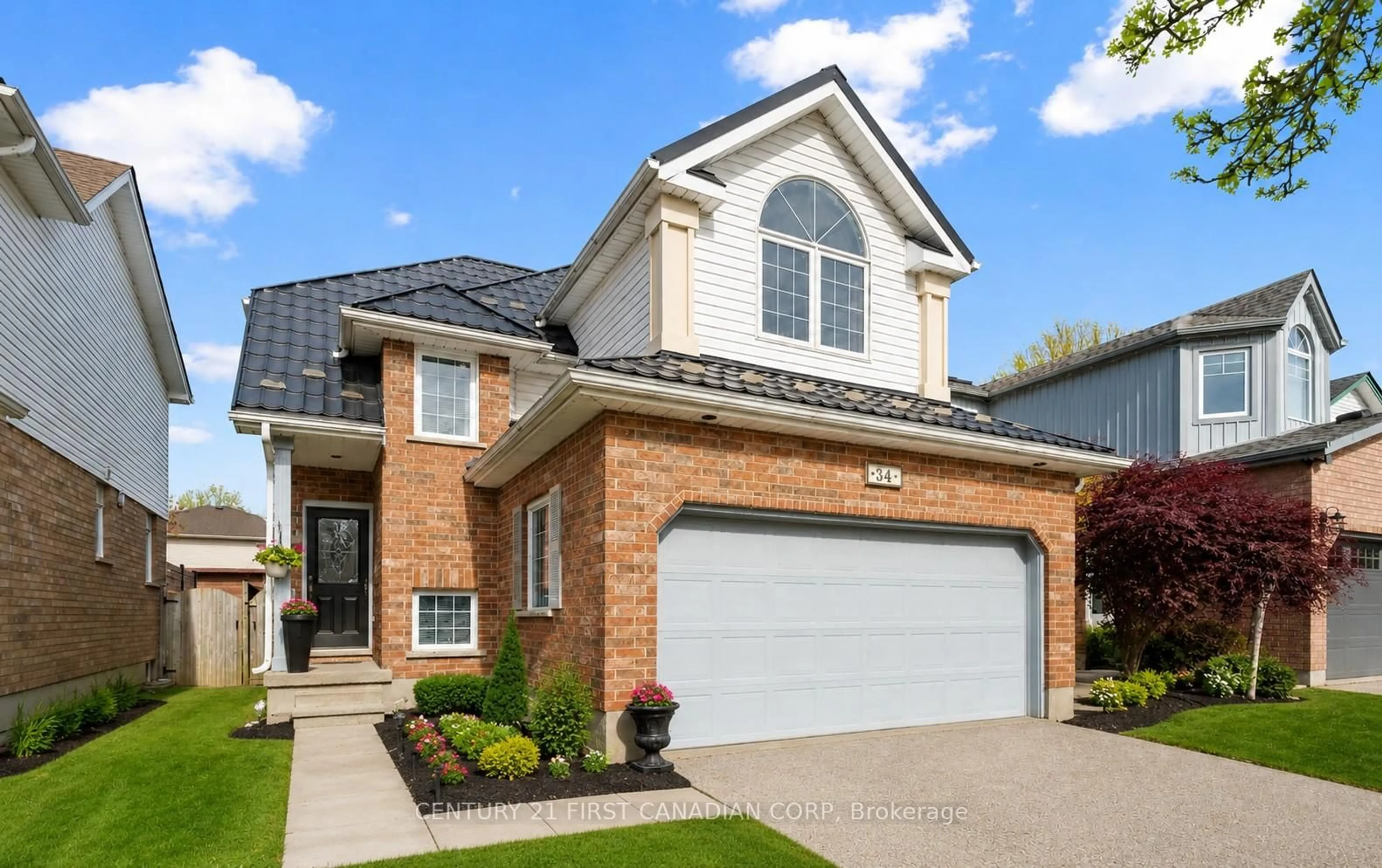 Home with brick exterior material, street for 34 Waxwing Cres, Guelph Ontario N1C 1E3