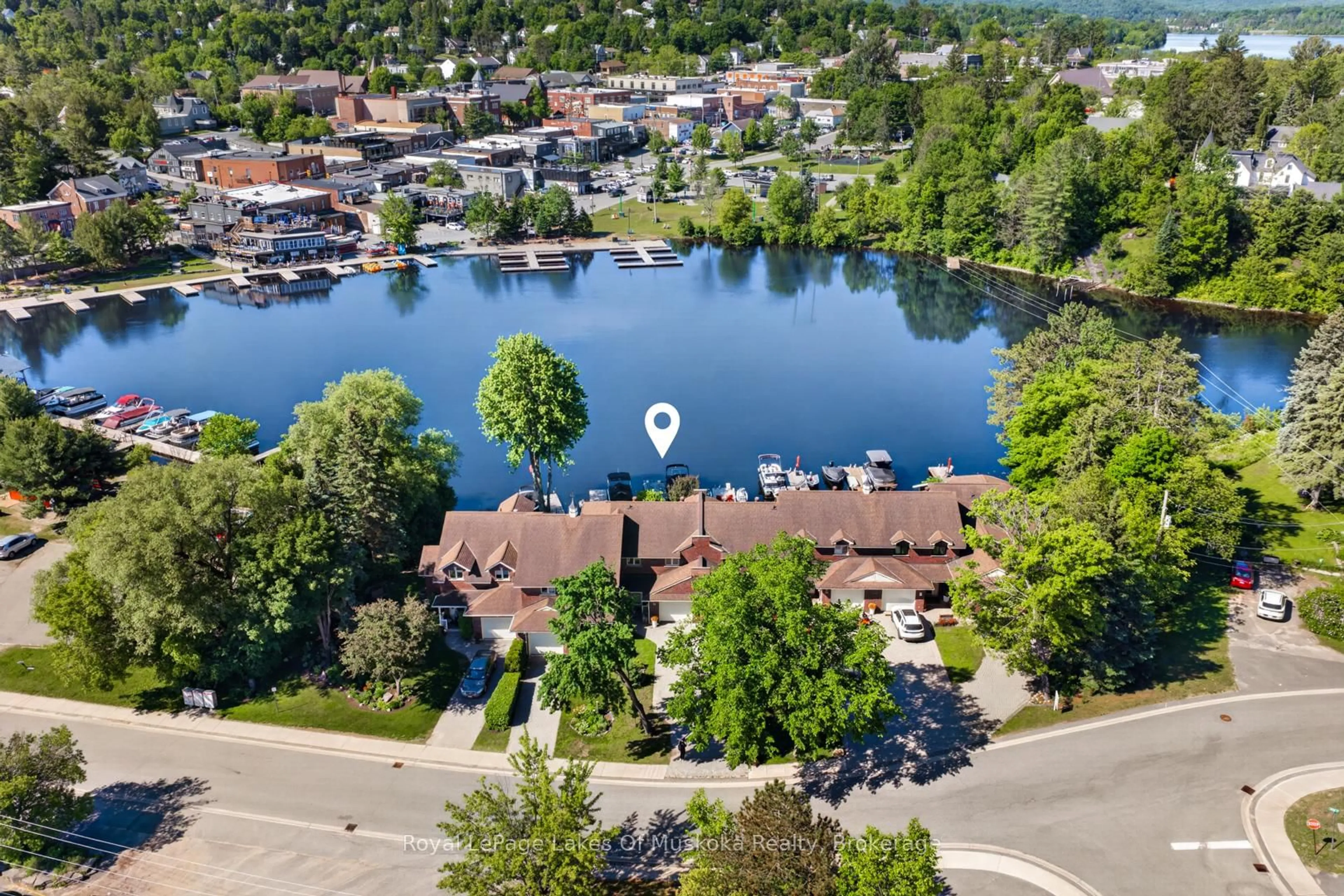 A pic from outside/outdoor area/front of a property/back of a property/a pic from drone, water/lake/river/ocean view for 19 John St, Huntsville Ontario P1H 1H2