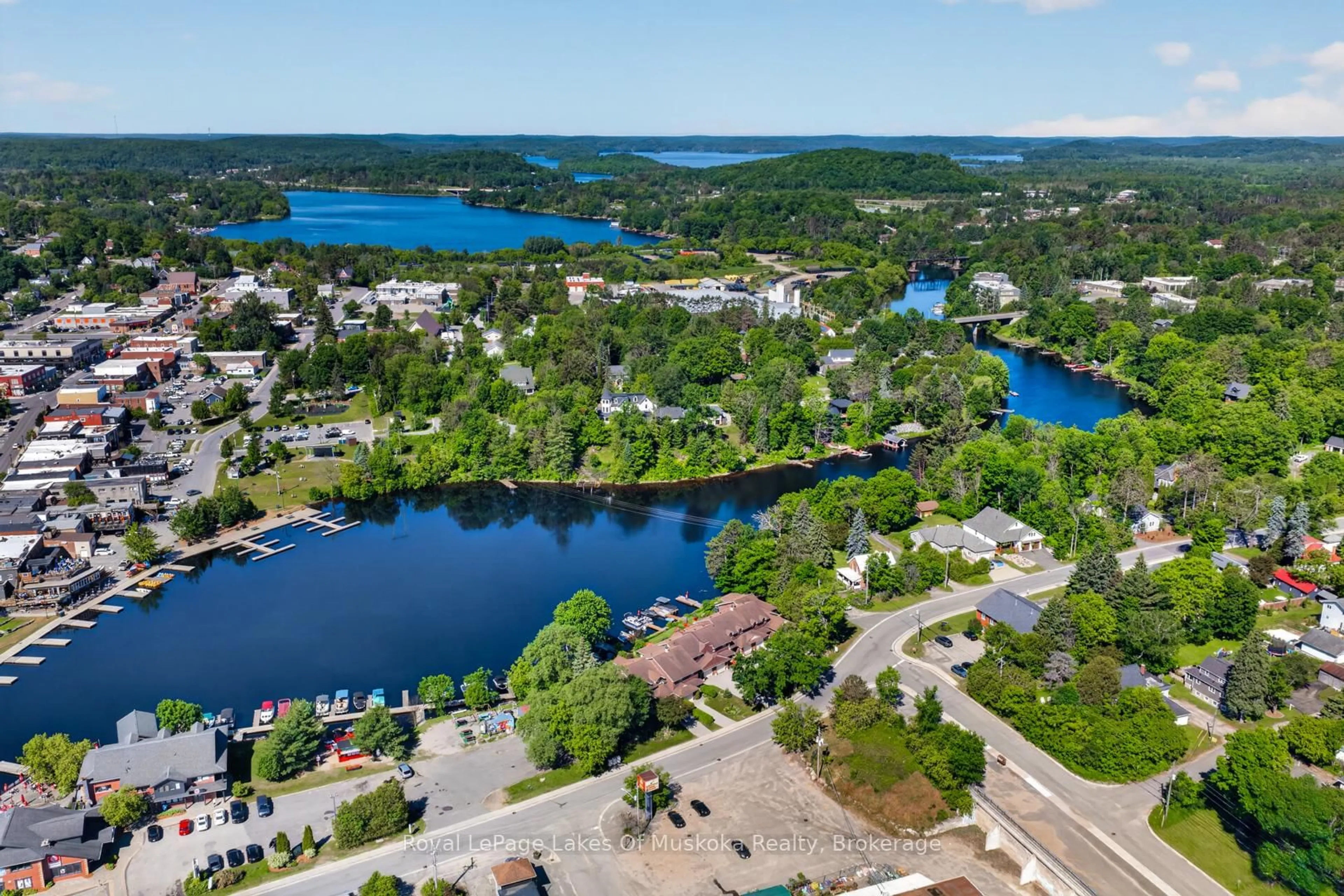 A pic from outside/outdoor area/front of a property/back of a property/a pic from drone, water/lake/river/ocean view for 19 John St, Huntsville Ontario P1H 1H2