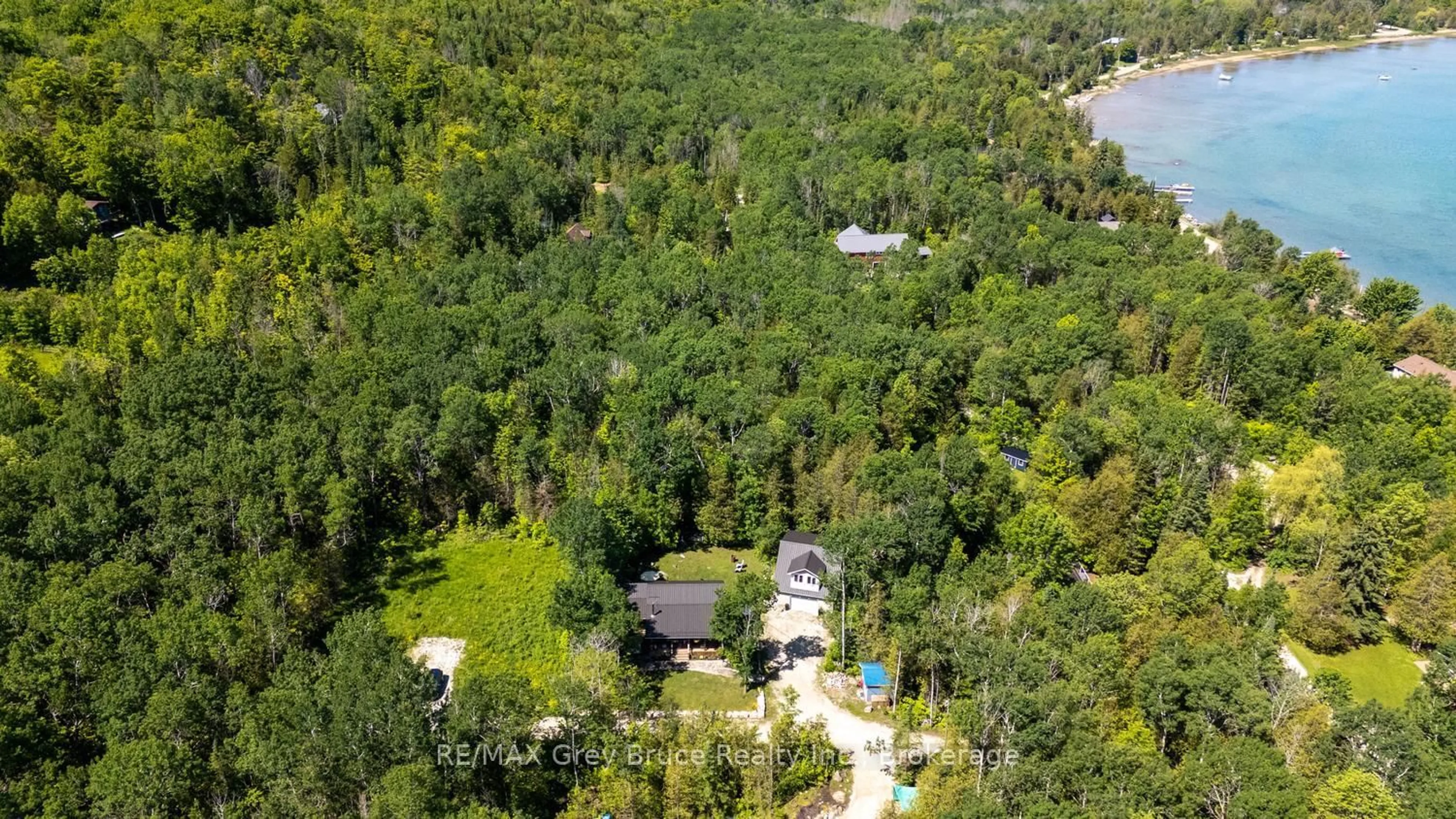 A pic from outside/outdoor area/front of a property/back of a property/a pic from drone, forest/trees view for 13A Morninghill Rd, South Bruce Peninsula Ontario N0H 2T0