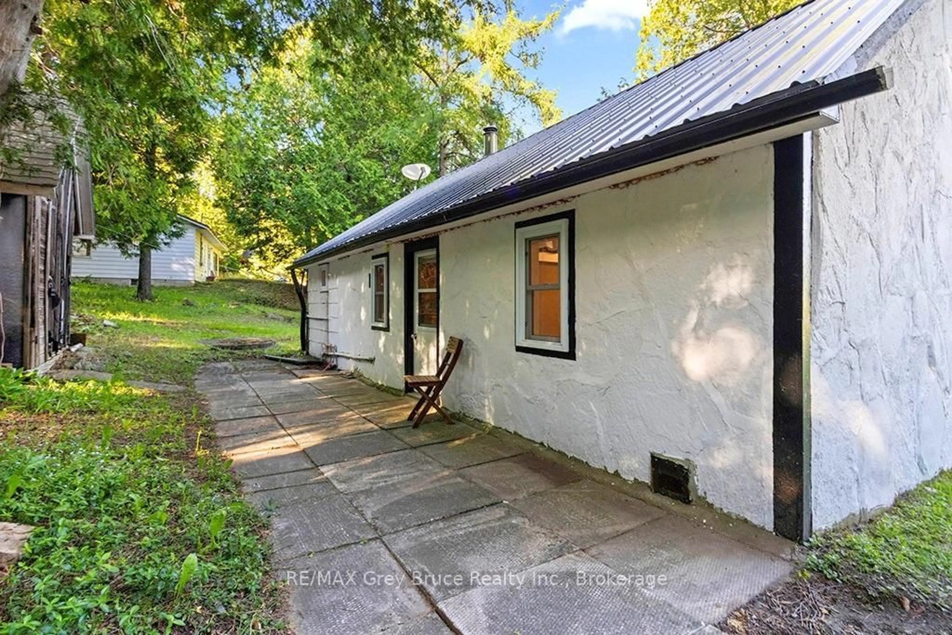 A pic from outside/outdoor area/front of a property/back of a property/a pic from drone, street for 609 Stokes Bay Rd, Northern Bruce Peninsula Ontario N0H 2M0
