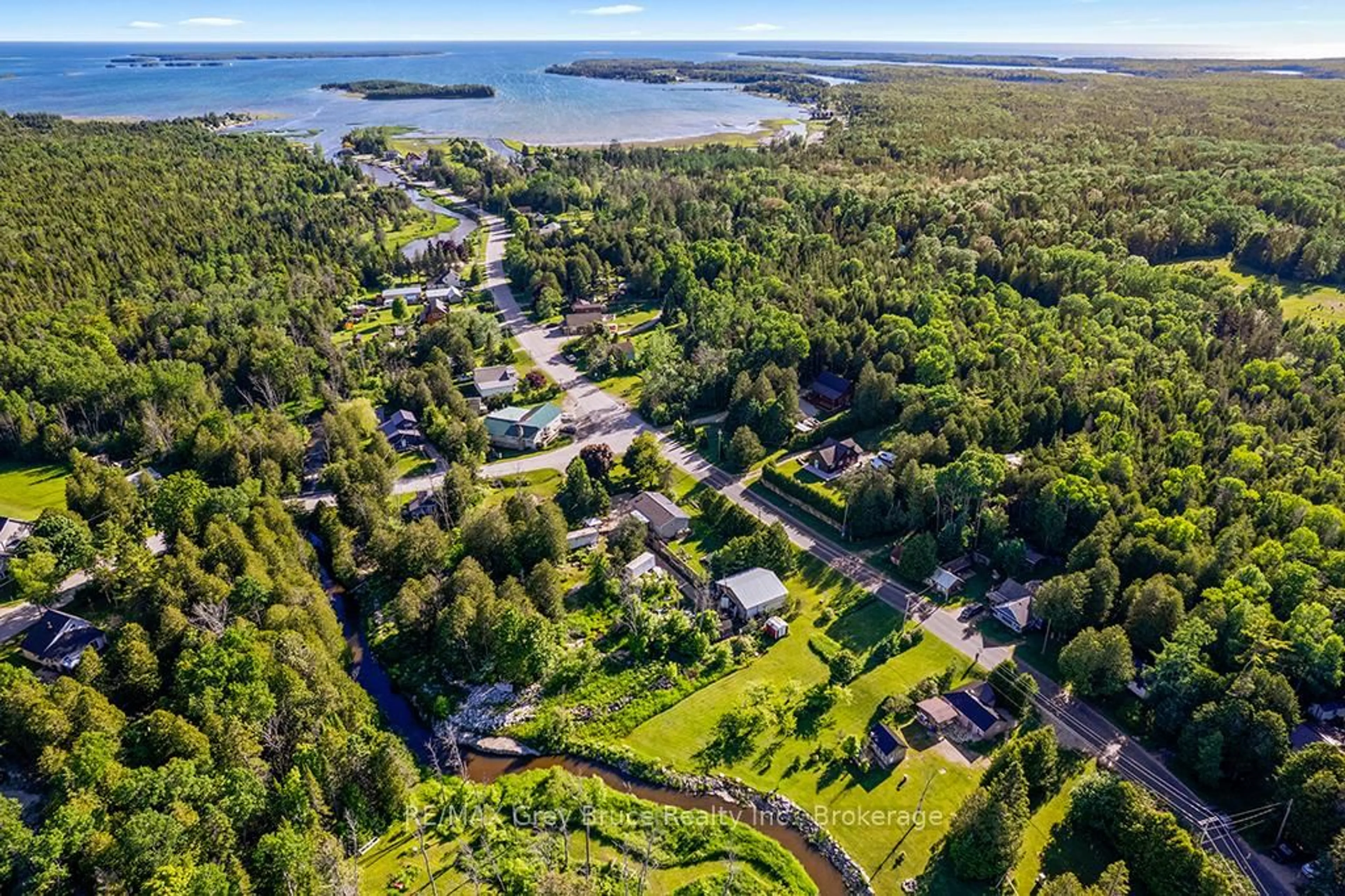 A pic from outside/outdoor area/front of a property/back of a property/a pic from drone, water/lake/river/ocean view for 609 Stokes Bay Rd, Northern Bruce Peninsula Ontario N0H 2M0