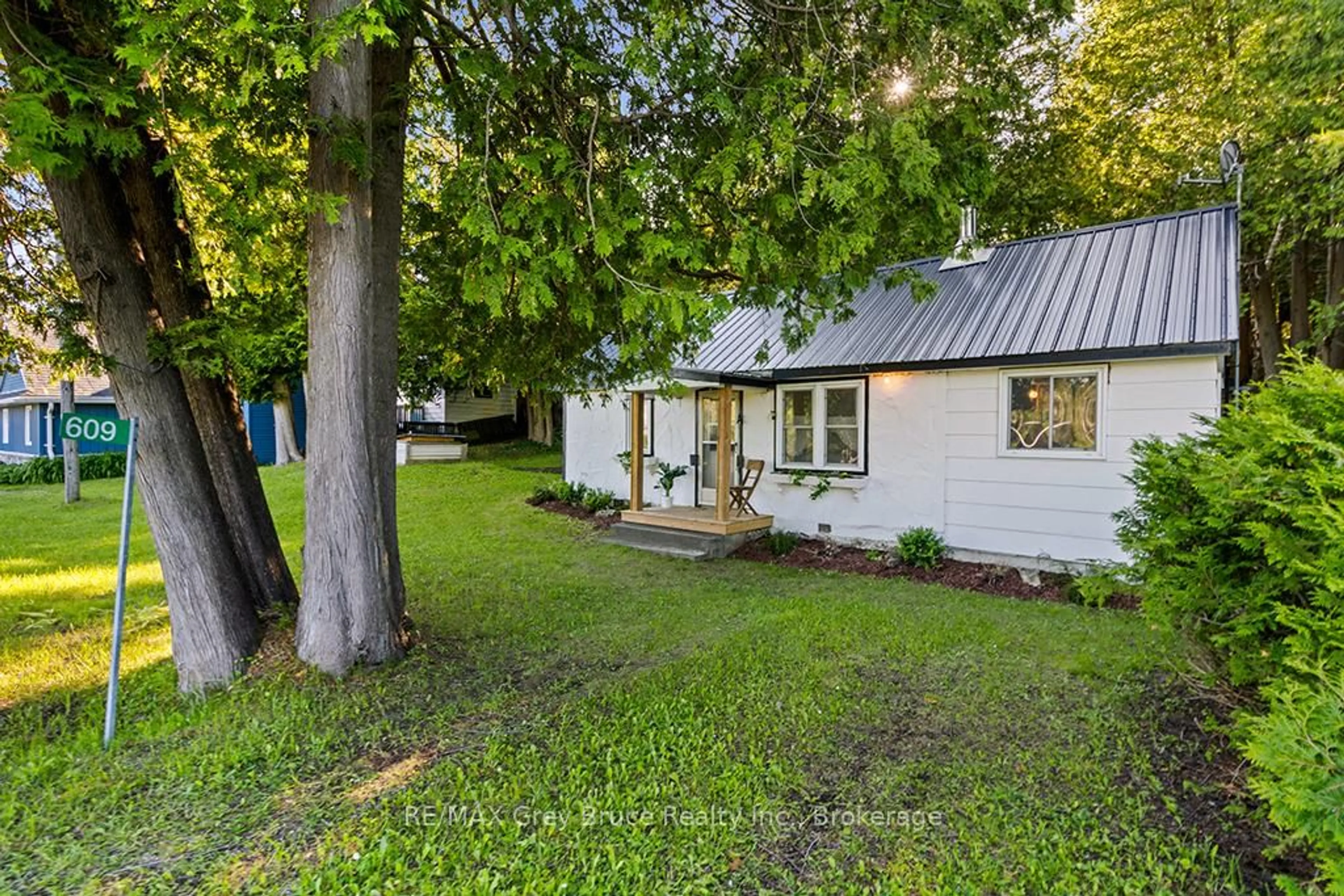 A pic from outside/outdoor area/front of a property/back of a property/a pic from drone, street for 609 Stokes Bay Rd, Northern Bruce Peninsula Ontario N0H 2M0