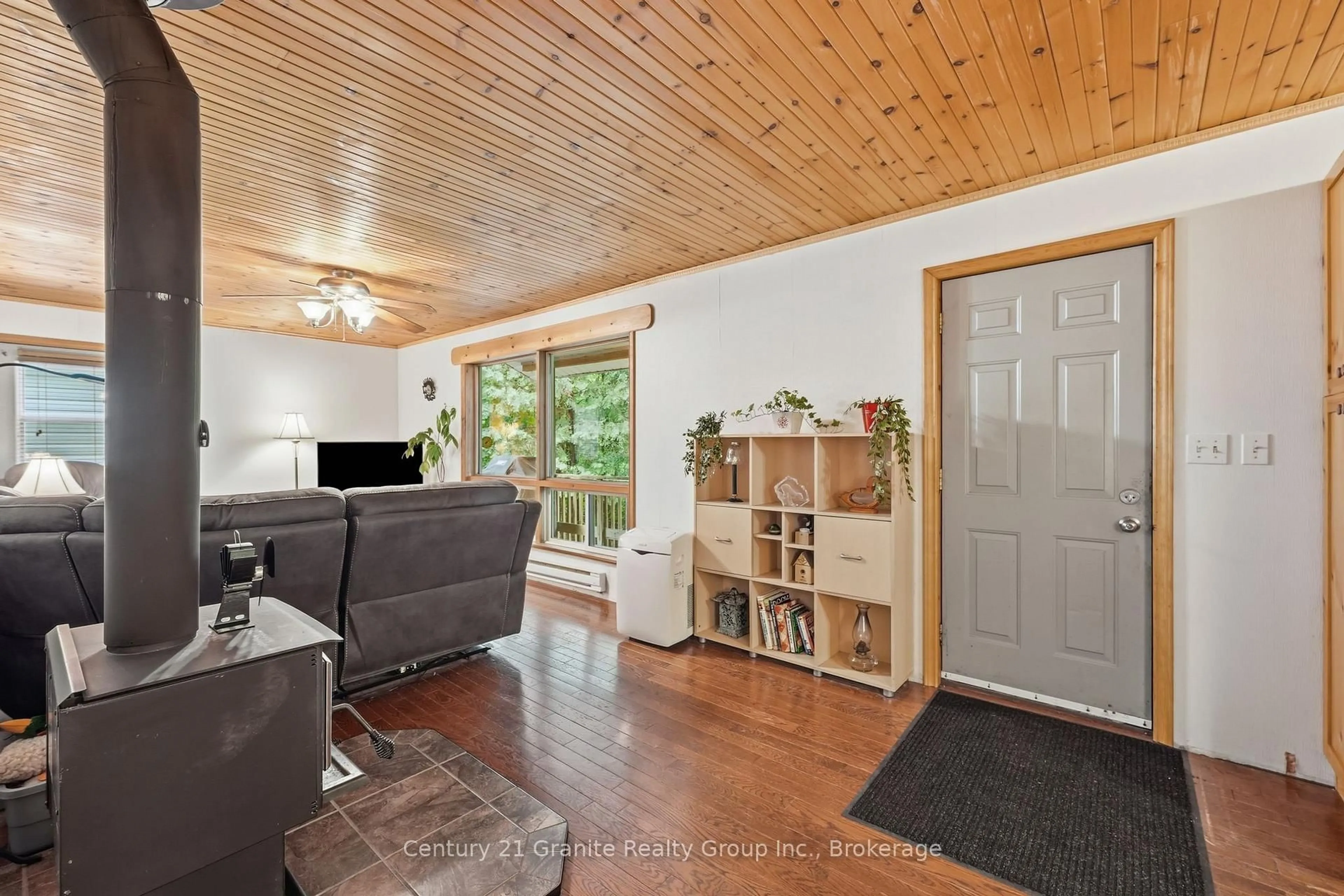 Living room with furniture, wood/laminate floor for 76 Rock Lake Crt, Bancroft Ontario K0L 1C0
