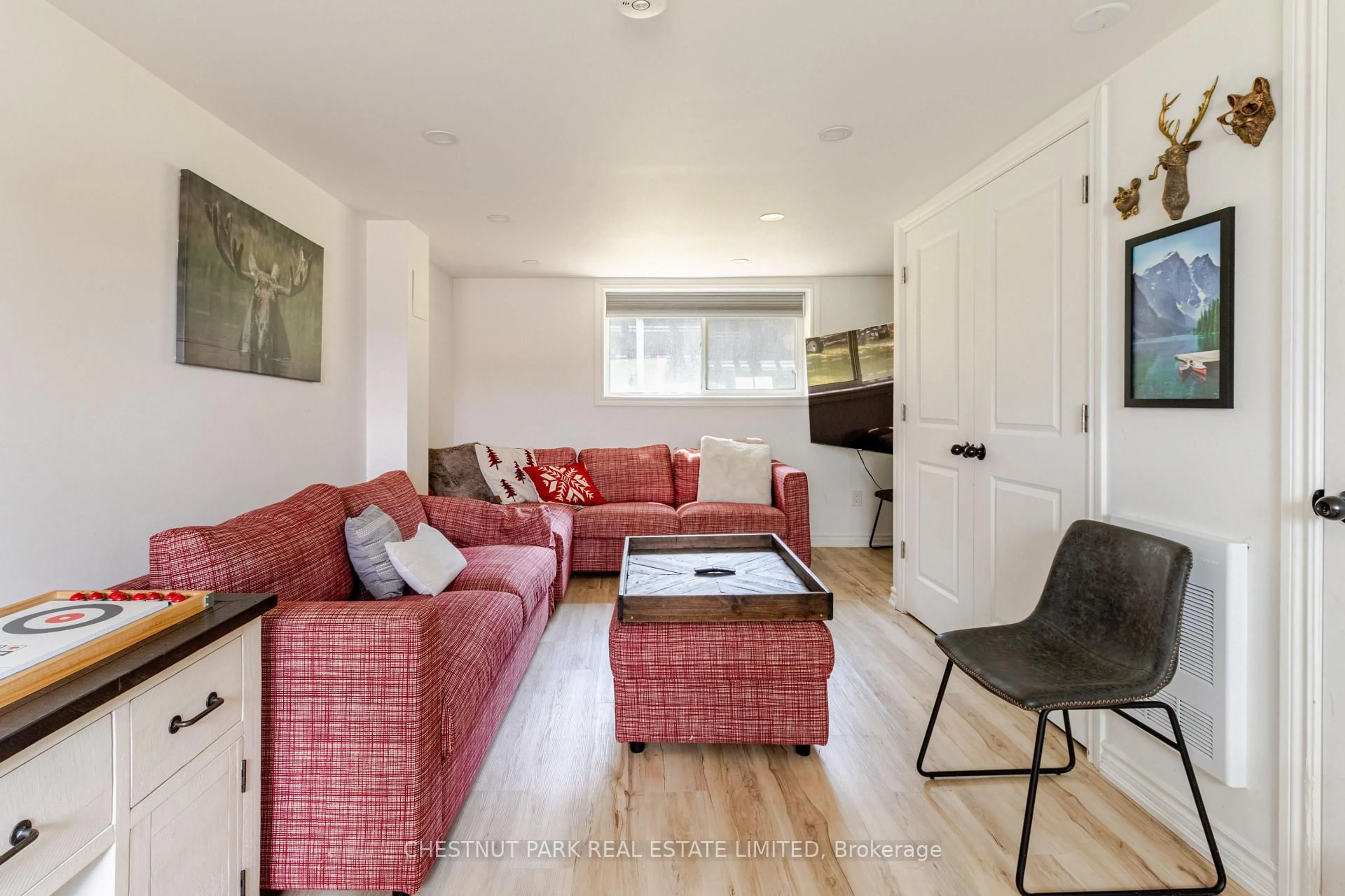 Living room with furniture, wood/laminate floor for 133 Island View Dr, Grey Highlands Ontario N0C 1E0