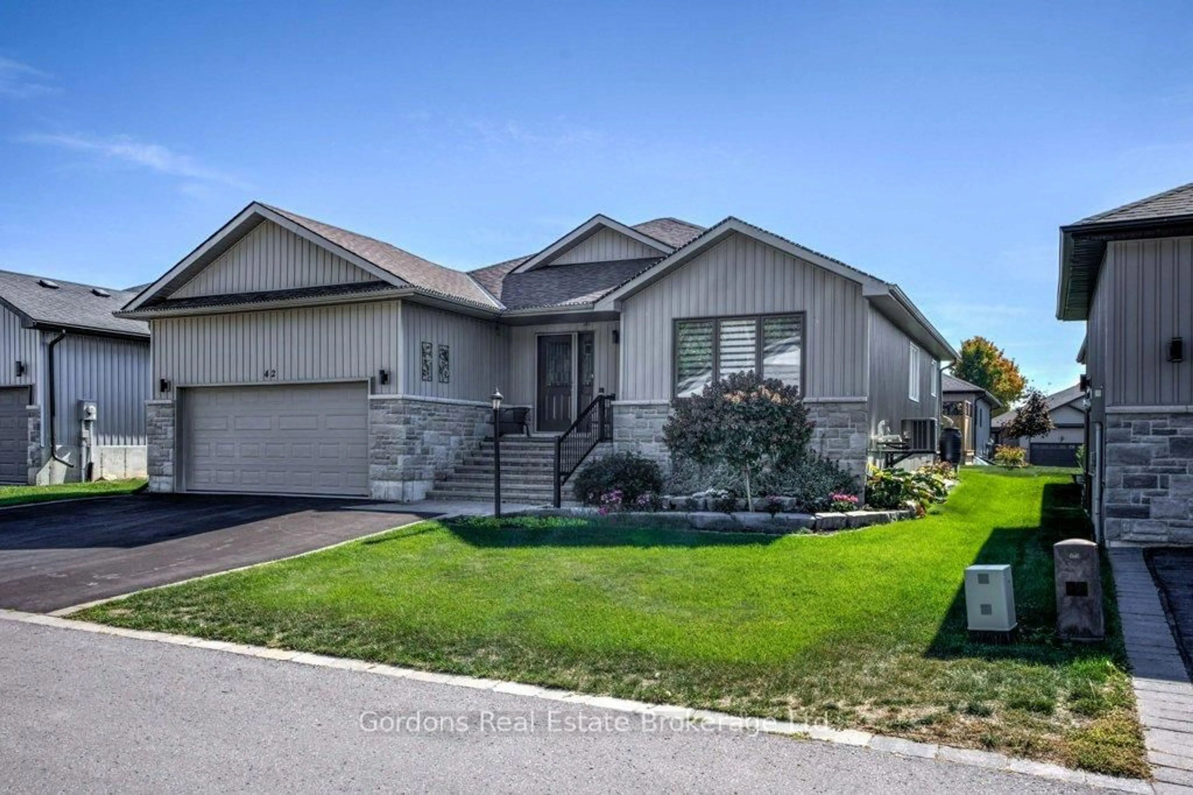 Home with vinyl exterior material, street for 42 Conger Dr, Prince Edward County Ontario K0K 3L0