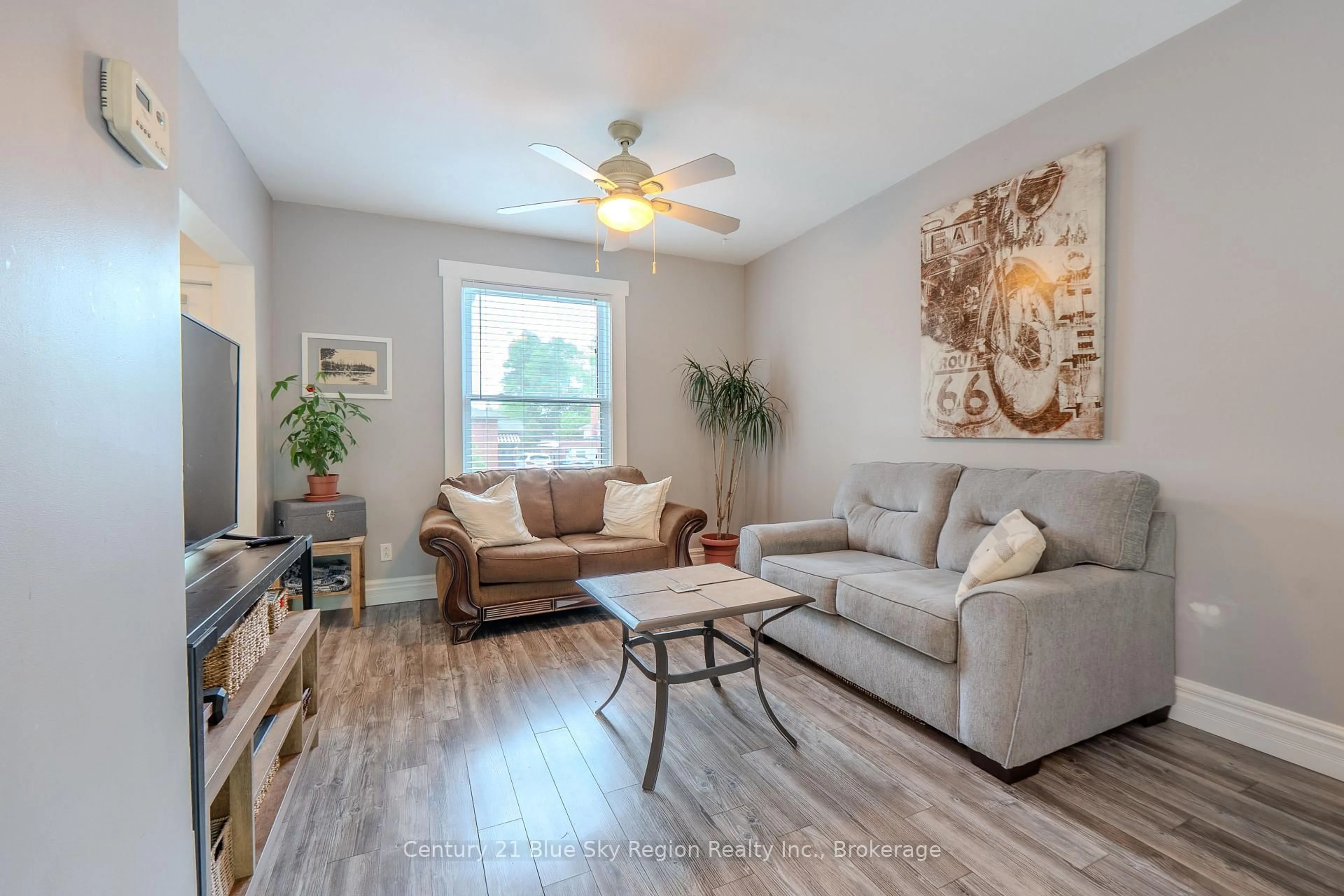 Living room with furniture, wood/laminate floor for 577 O'Brien St, North Bay Ontario P1B 5W5