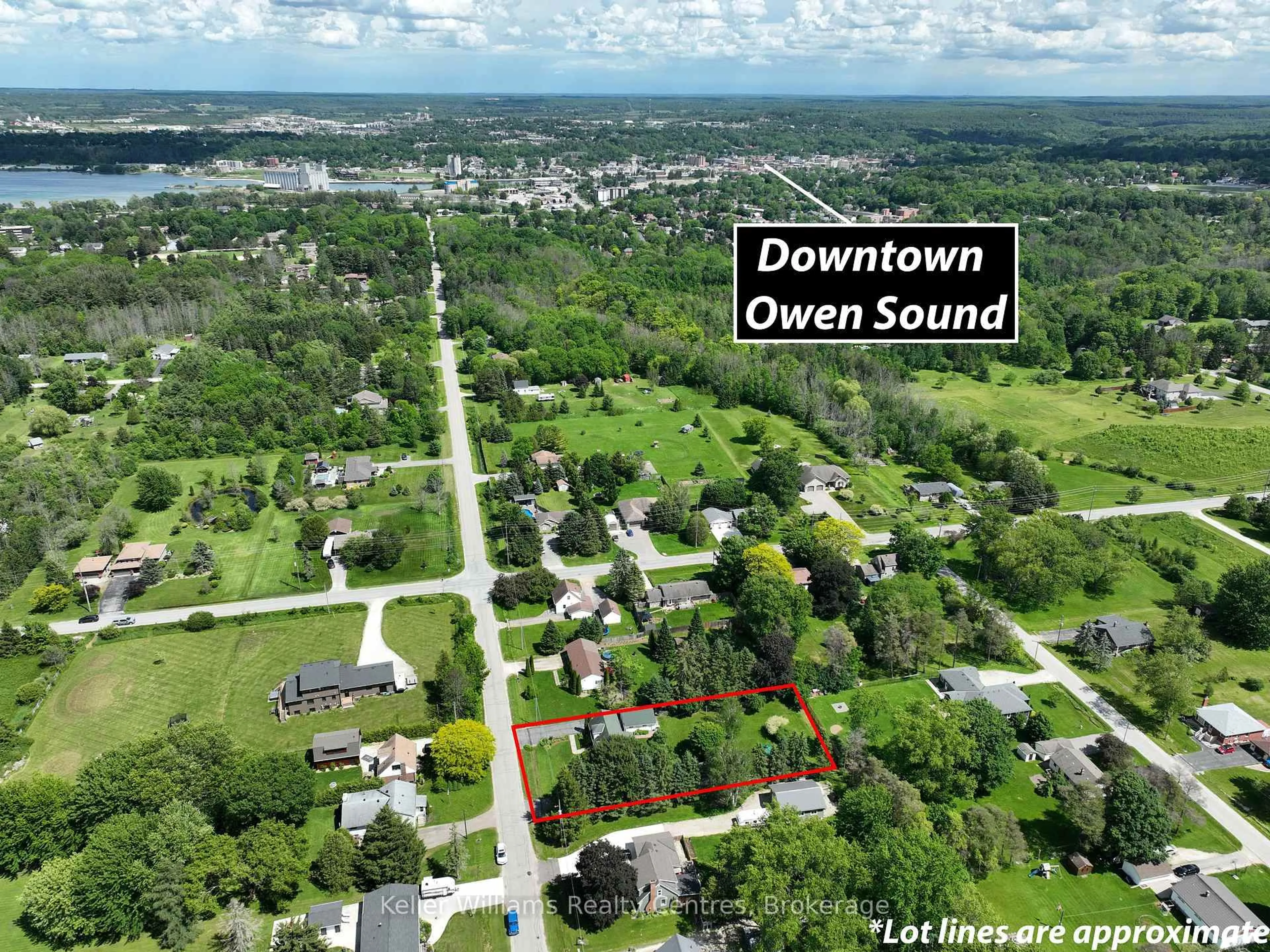 A pic from outside/outdoor area/front of a property/back of a property/a pic from drone, water/lake/river/ocean view for 880 16th St, Georgian Bluffs Ontario N4K 6V5