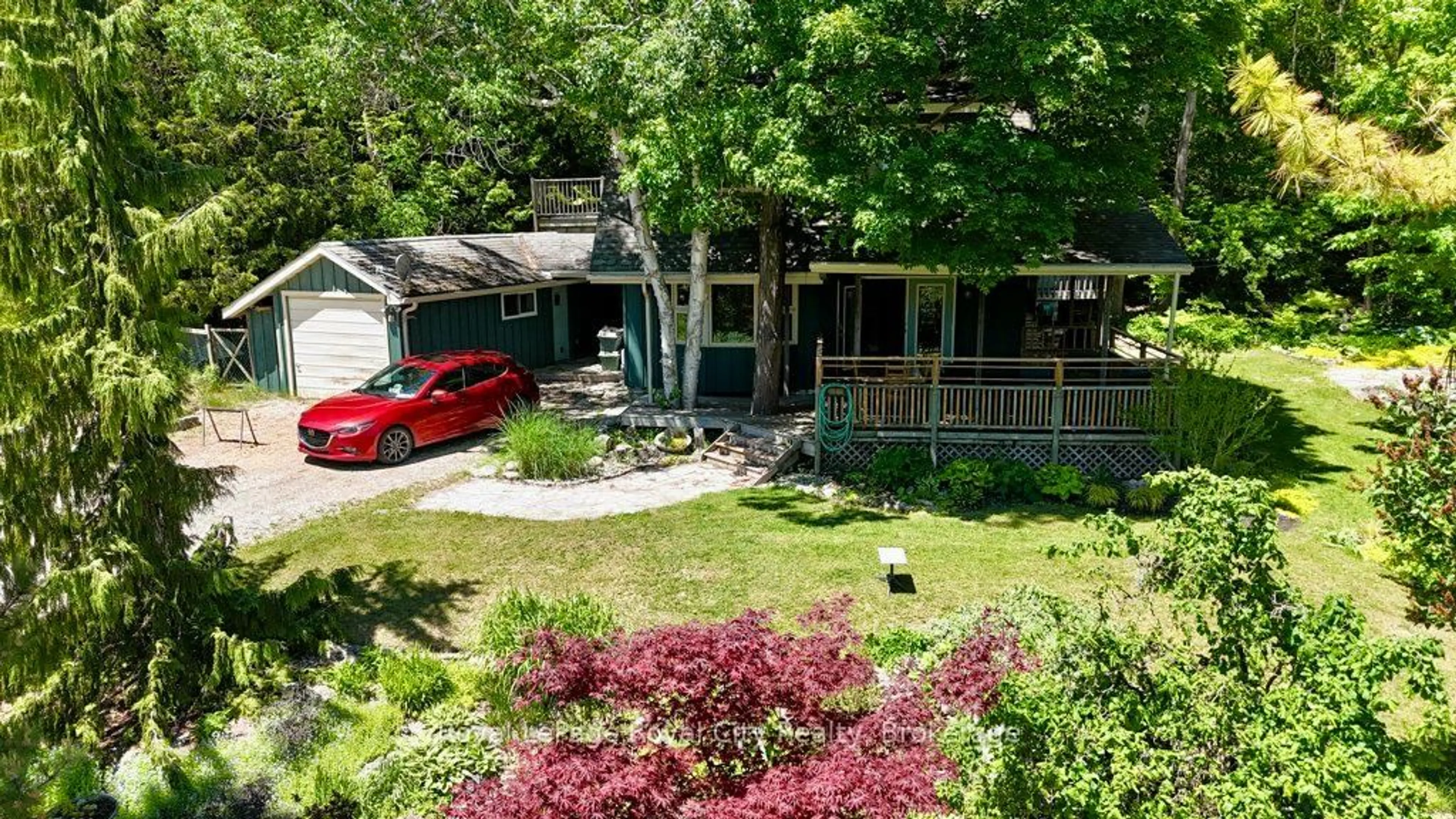 A pic from outside/outdoor area/front of a property/back of a property/a pic from drone, street for 11 Shoreline Dr, Northern Bruce Peninsula Ontario N0H 1Z0