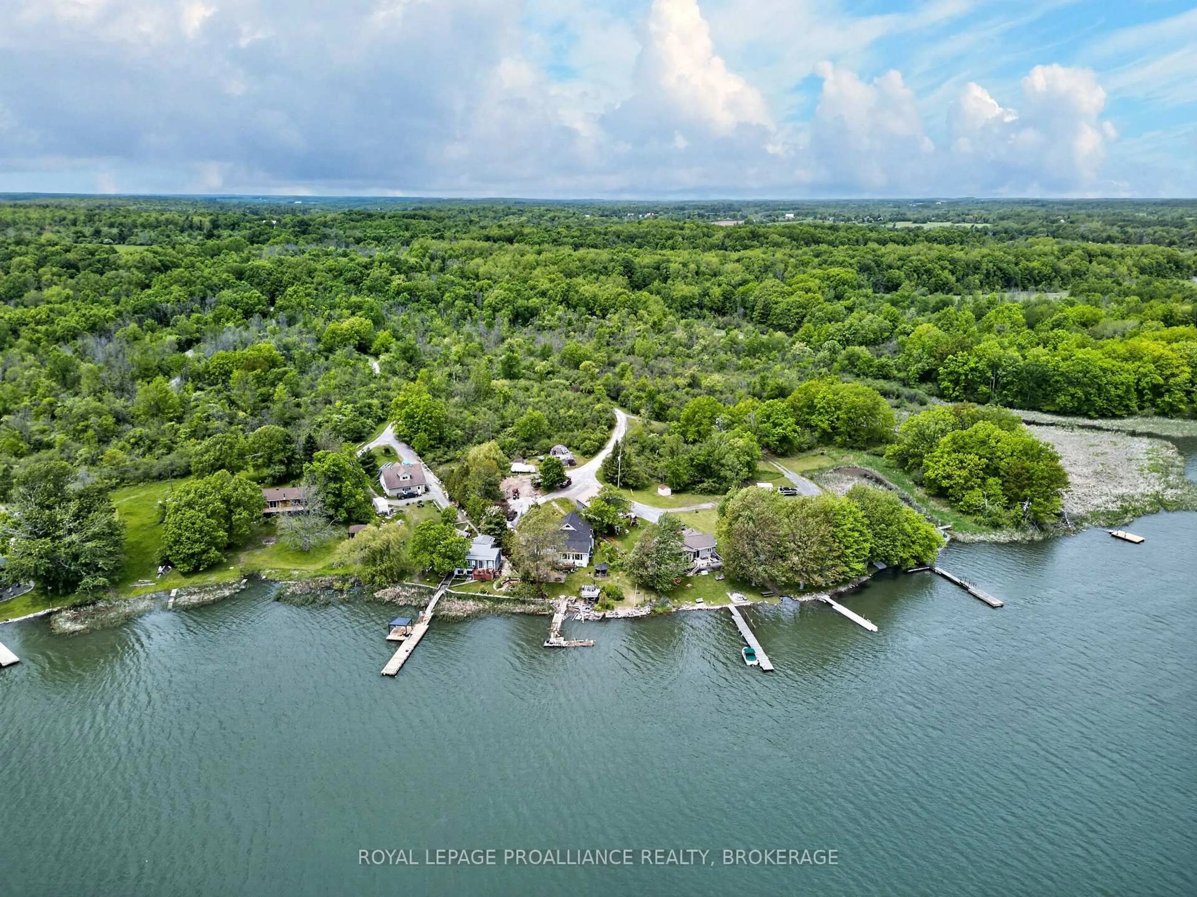 A pic from outside/outdoor area/front of a property/back of a property/a pic from drone, water/lake/river/ocean view for 229 Johnson Bay Lane, Gananoque Ontario K7G 2V6