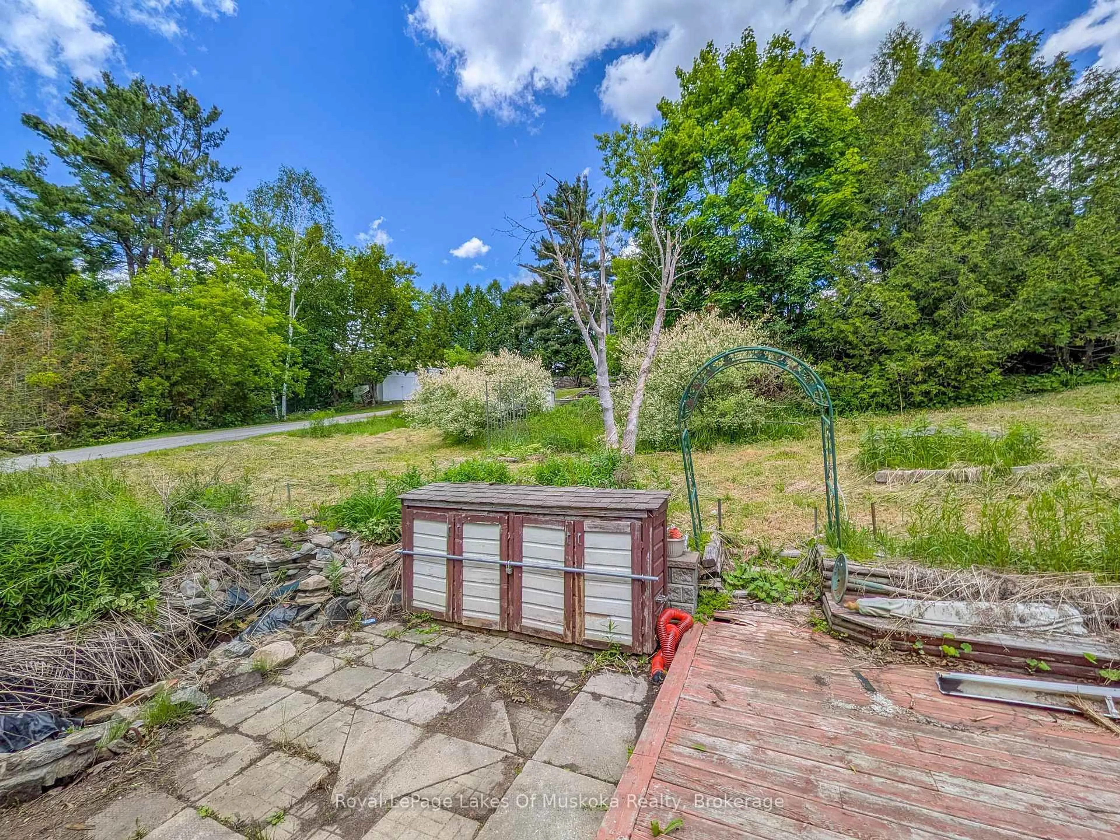 A pic from outside/outdoor area/front of a property/back of a property/a pic from drone, forest/trees view for 12 Valley Dr, Bracebridge Ontario P1L 1B8