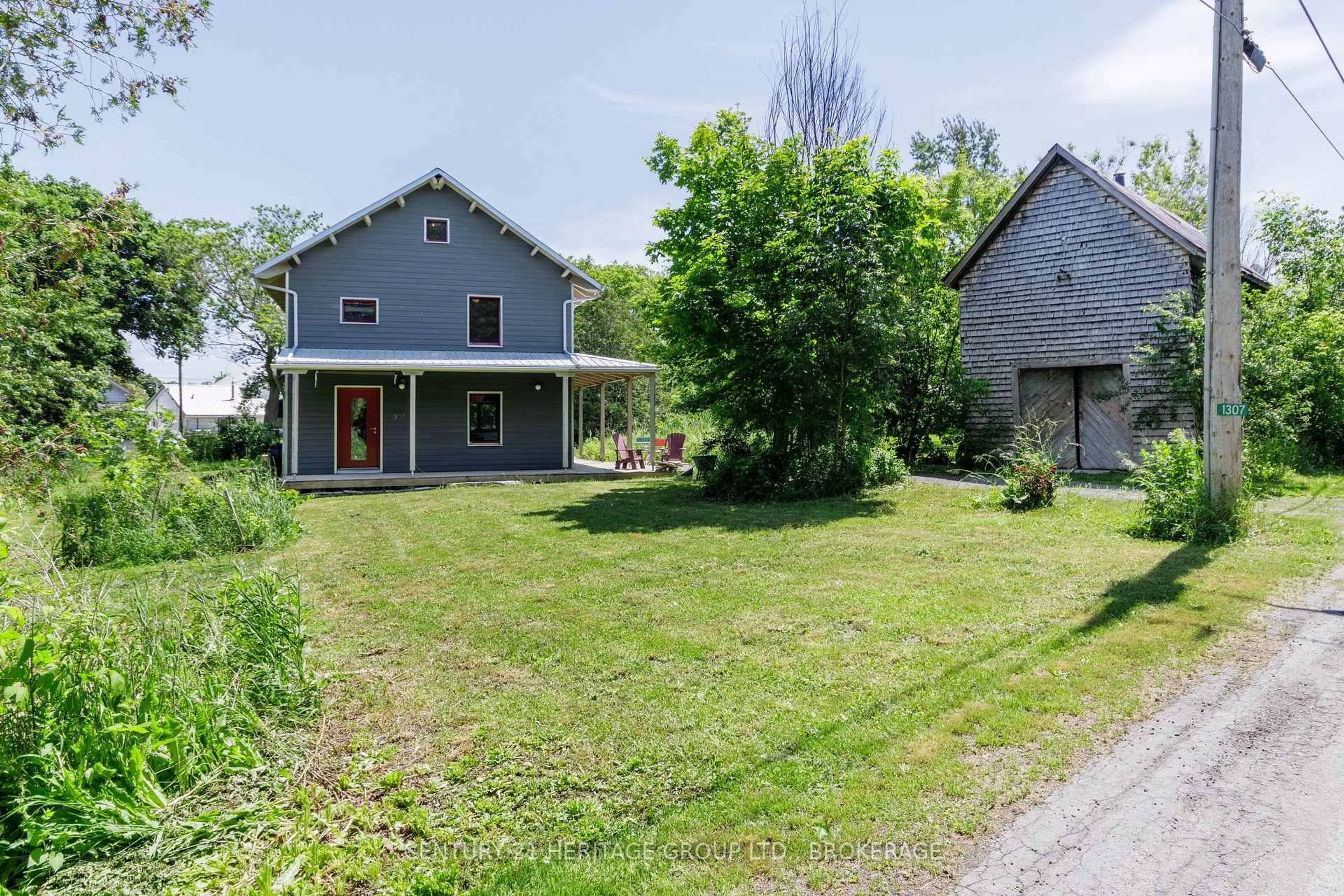 A pic from outside/outdoor area/front of a property/back of a property/a pic from drone, street for 1307 Going St, Wolfe Island Ontario K0H 2Y0