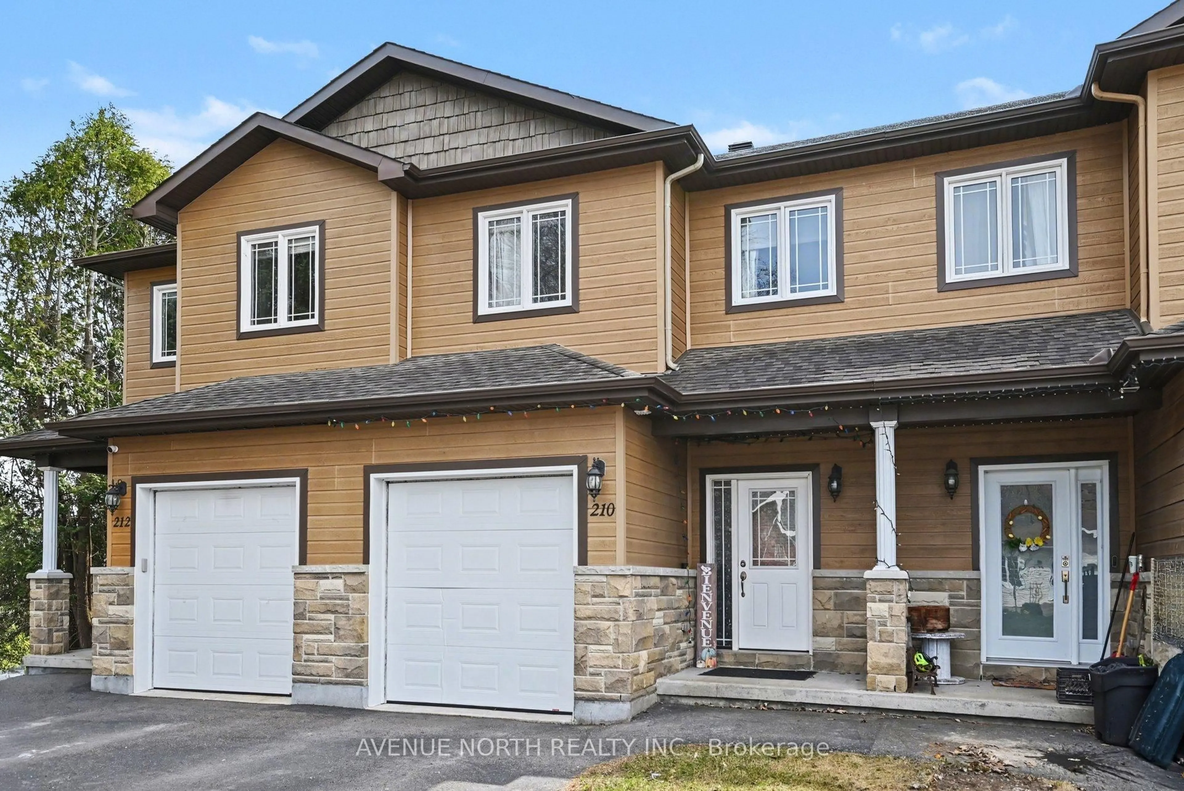 Home with vinyl exterior material, street for 210 Herbert St, The Nation Ontario K0A 2M0