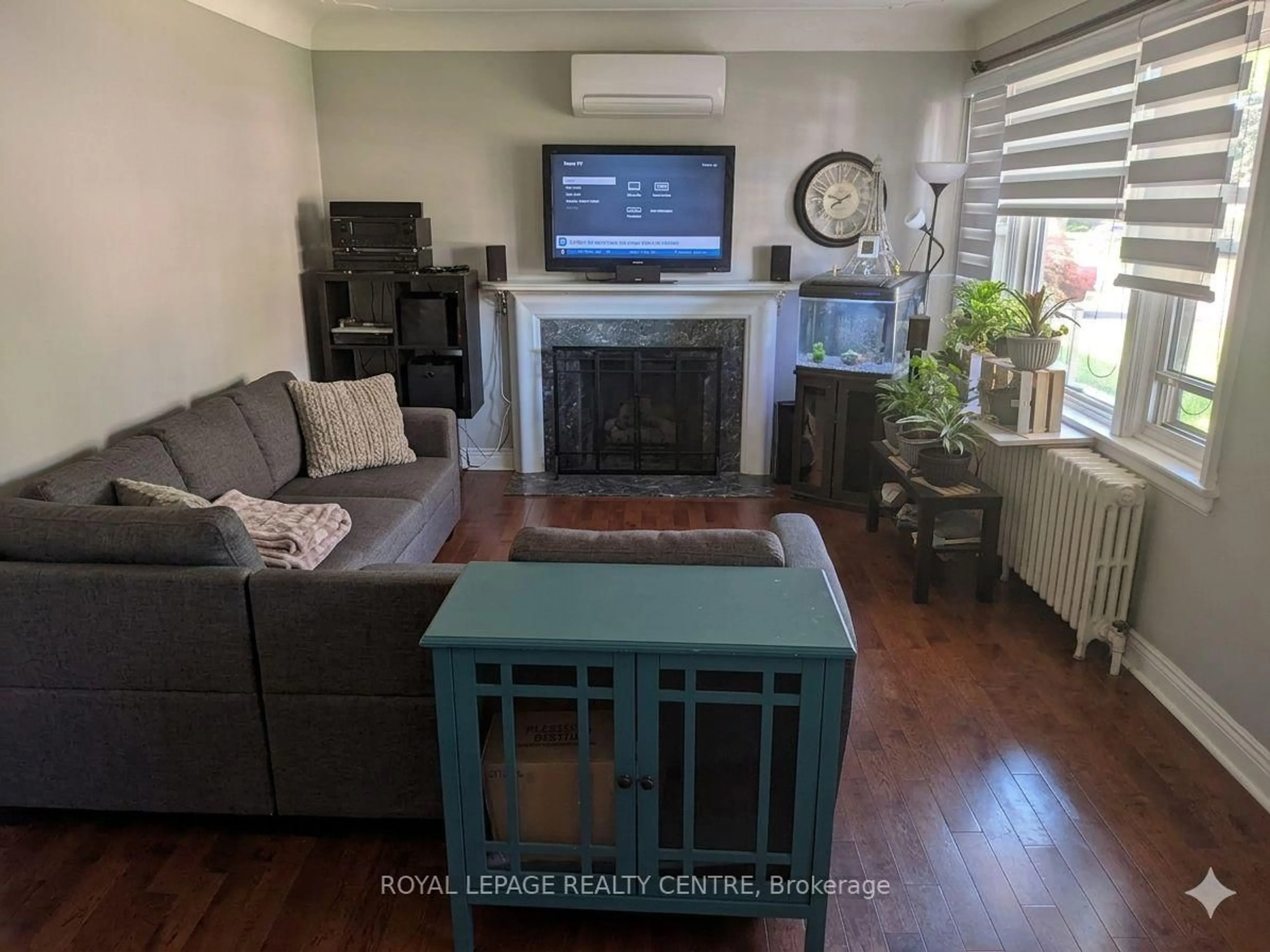 Living room with furniture, wood/laminate floor for 114 First St, Hamilton Ontario L8G 1Y4