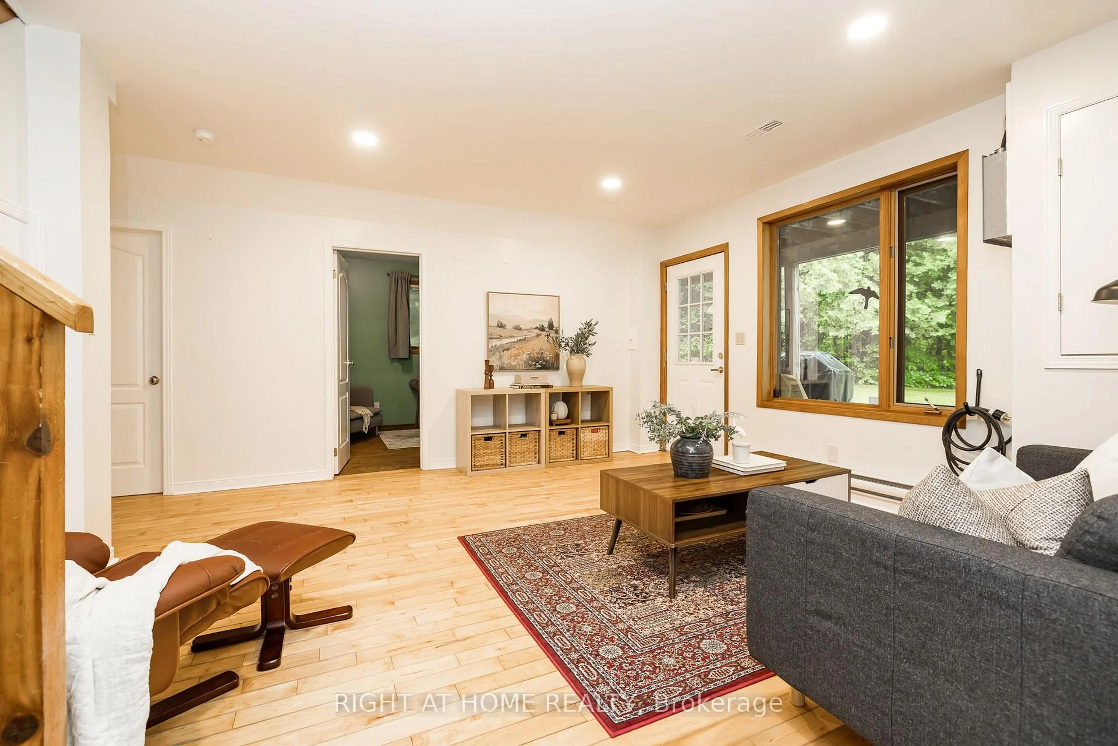 Living room with furniture, wood/laminate floor for 1828 Burnt Lands Rd, Carp Ontario K0A 1L0