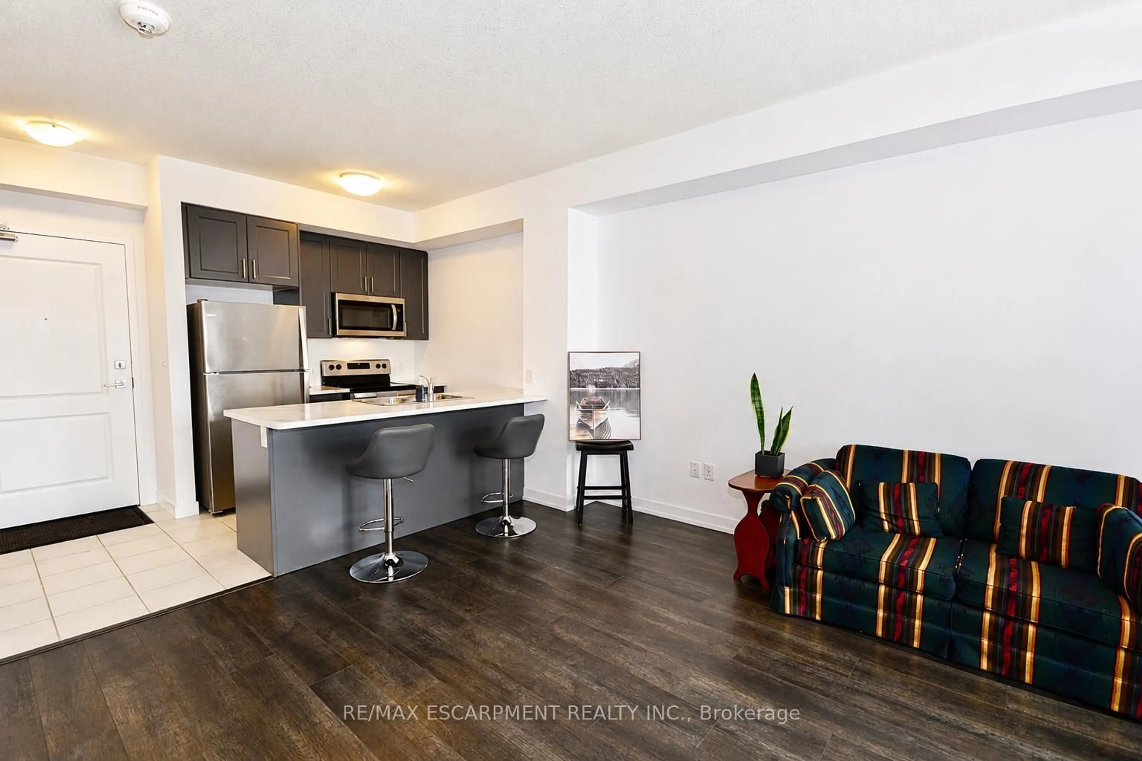 Open concept kitchen, wood/laminate floor for 450 Dundas St #404, Hamilton Ontario L8B 0L7