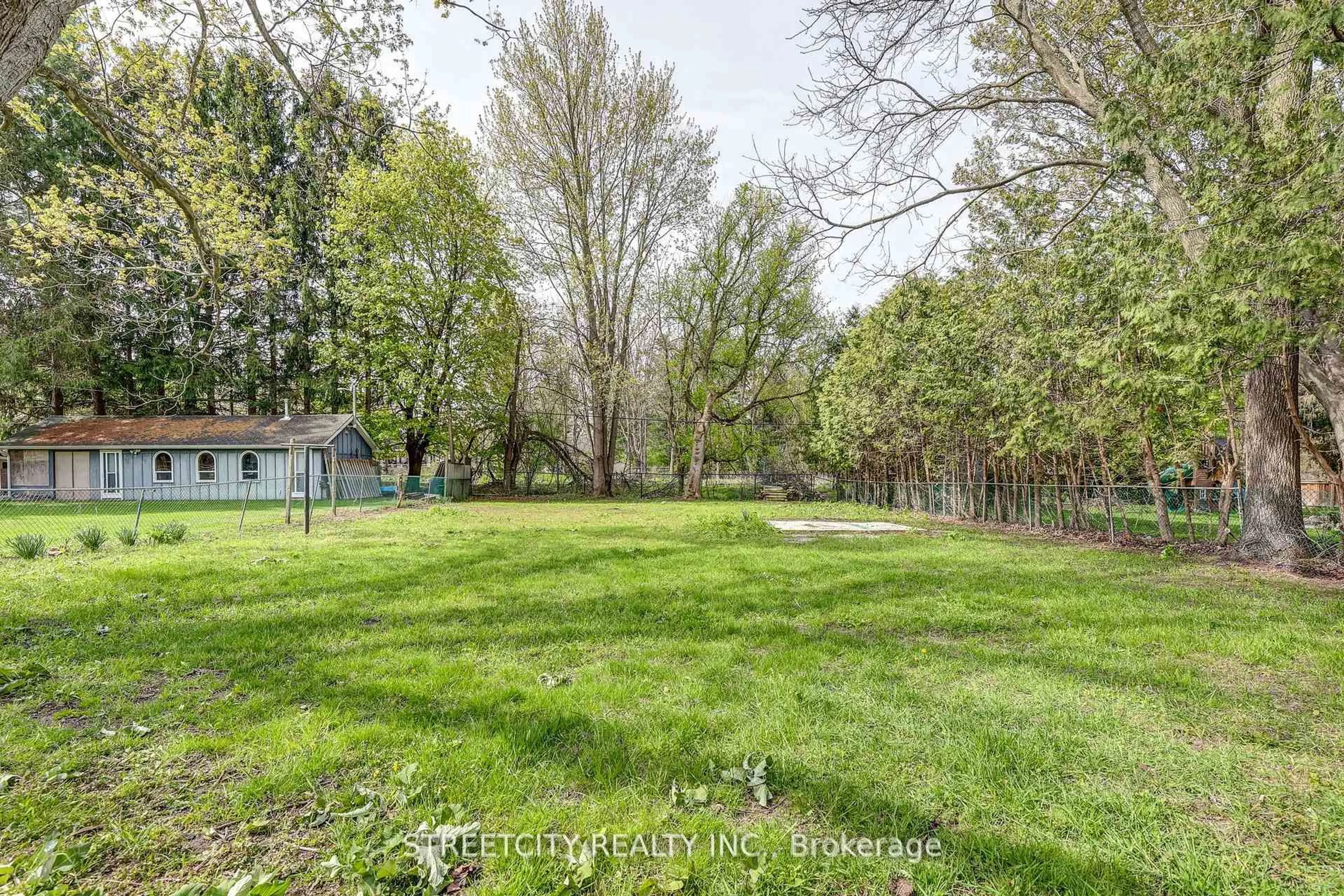 A pic from outside/outdoor area/front of a property/back of a property/a pic from drone, forest/trees view for 10 Vineden Dr, Central Elgin Ontario N5P 2M6