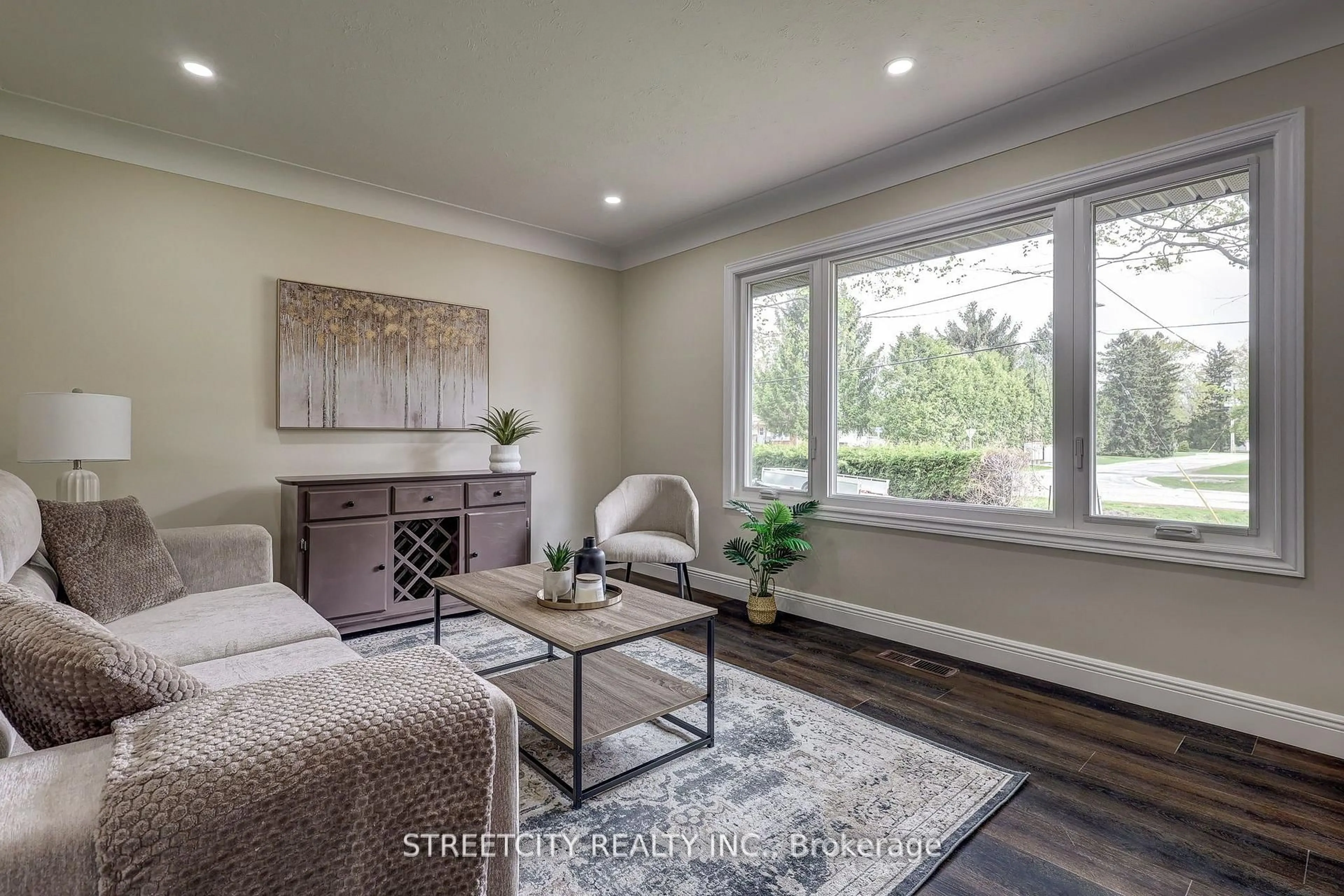 Living room with furniture, wood/laminate floor for 10 Vineden Dr, Central Elgin Ontario N5P 2M6