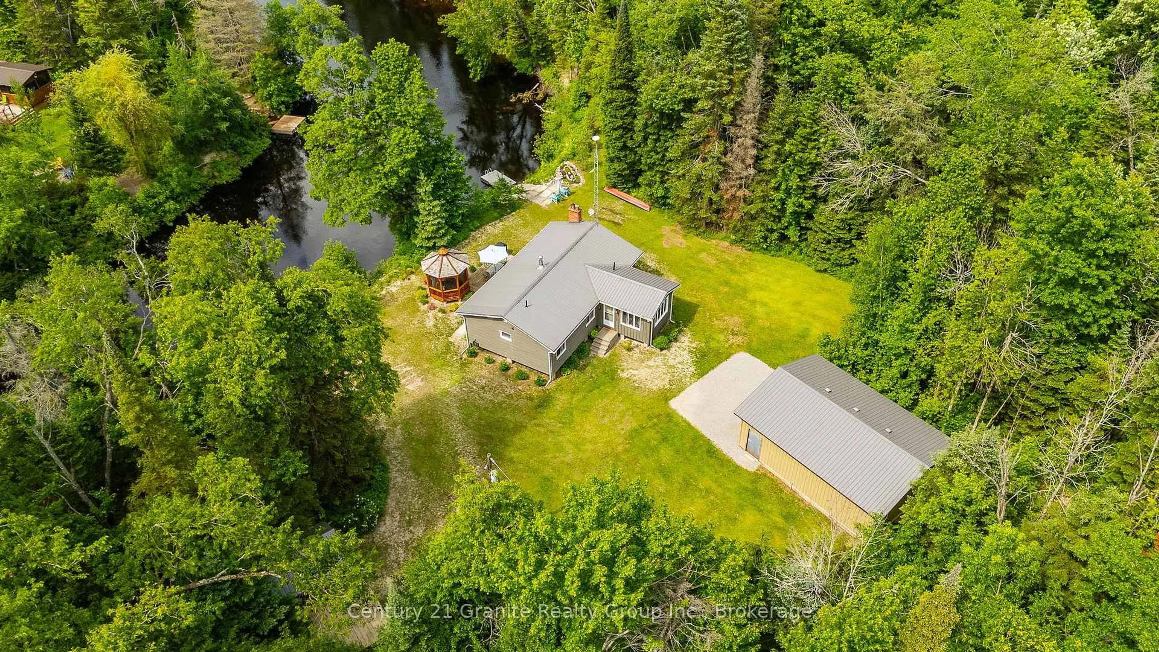 A pic from outside/outdoor area/front of a property/back of a property/a pic from drone, unknown for 1075 Hobbits Lane, Minden Hills Ontario K0M 2A1