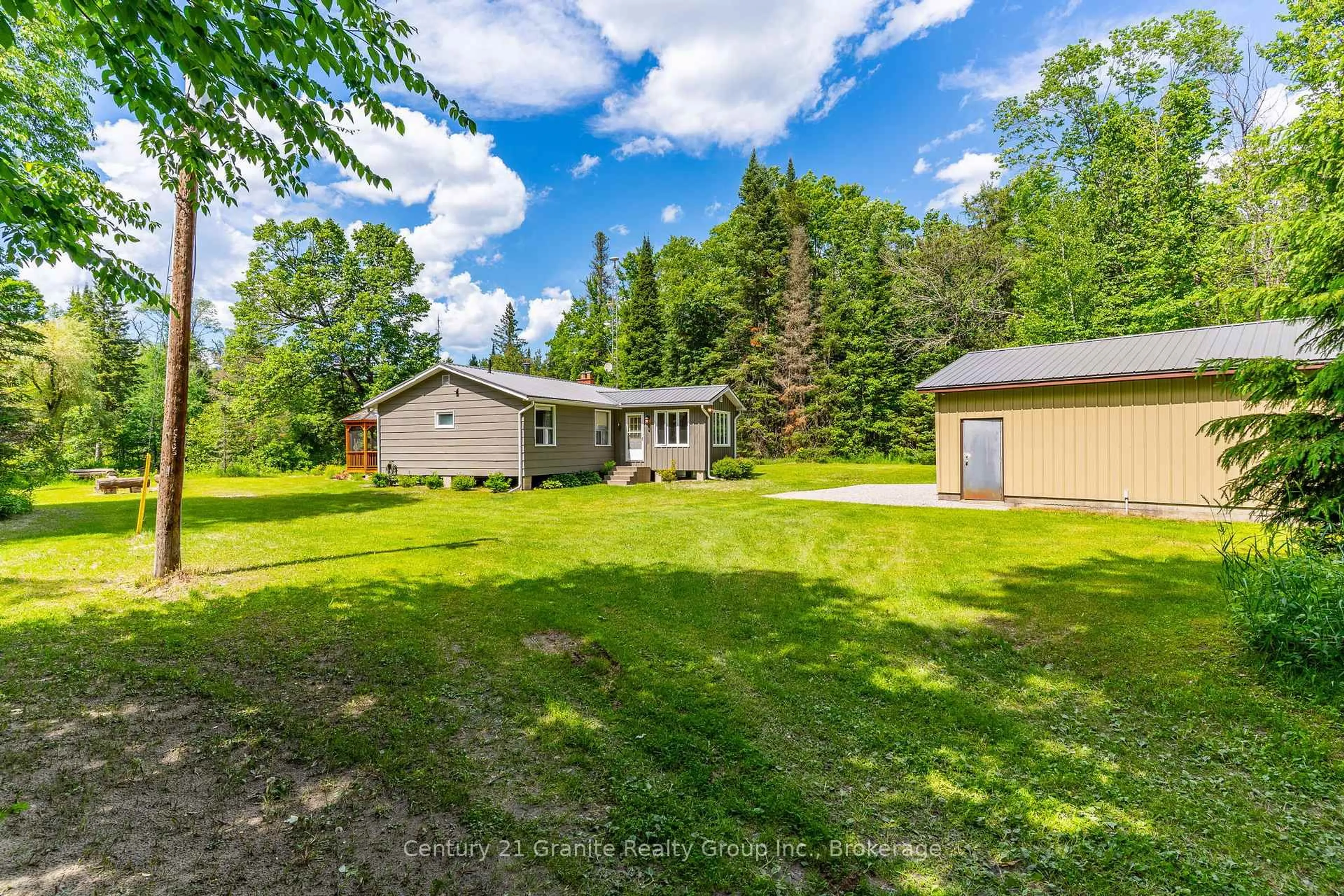 A pic from outside/outdoor area/front of a property/back of a property/a pic from drone, unknown for 1075 Hobbits Lane, Minden Hills Ontario K0M 2A1