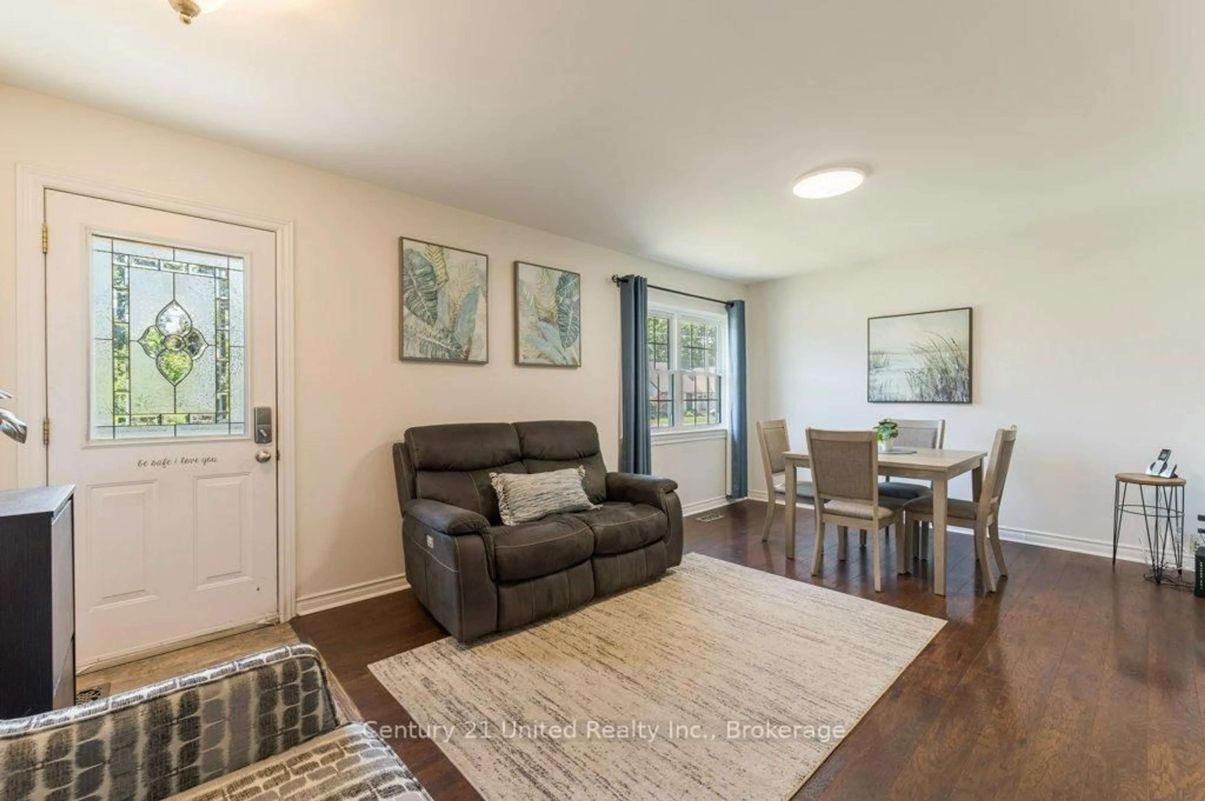 Living room with furniture, wood/laminate floor for 470 O'connell Rd, Peterborough Ontario K9J 4C9