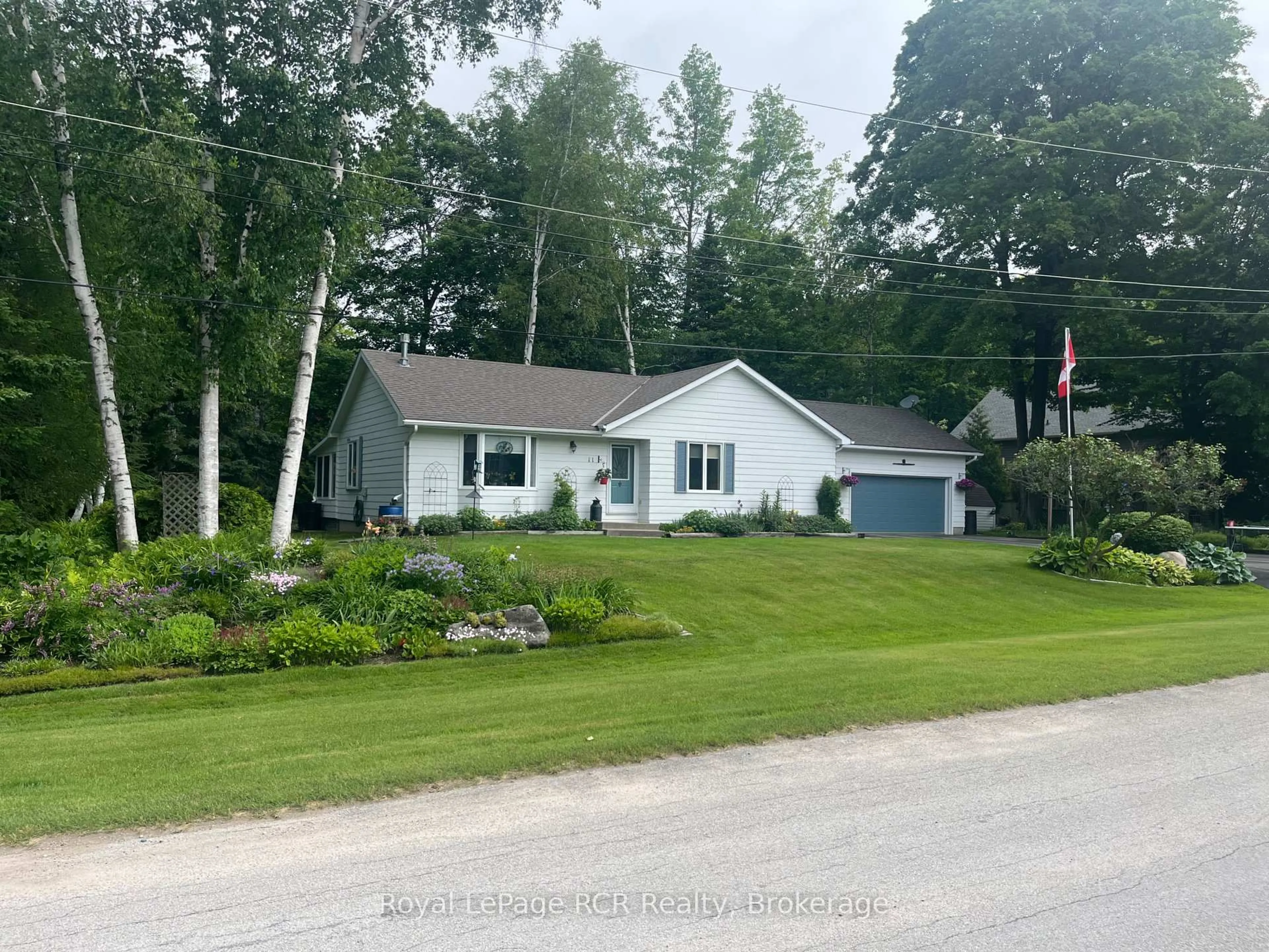 A pic from outside/outdoor area/front of a property/back of a property/a pic from drone, street for 11 Graham Cres, South Bruce Peninsula Ontario N0H 2G0