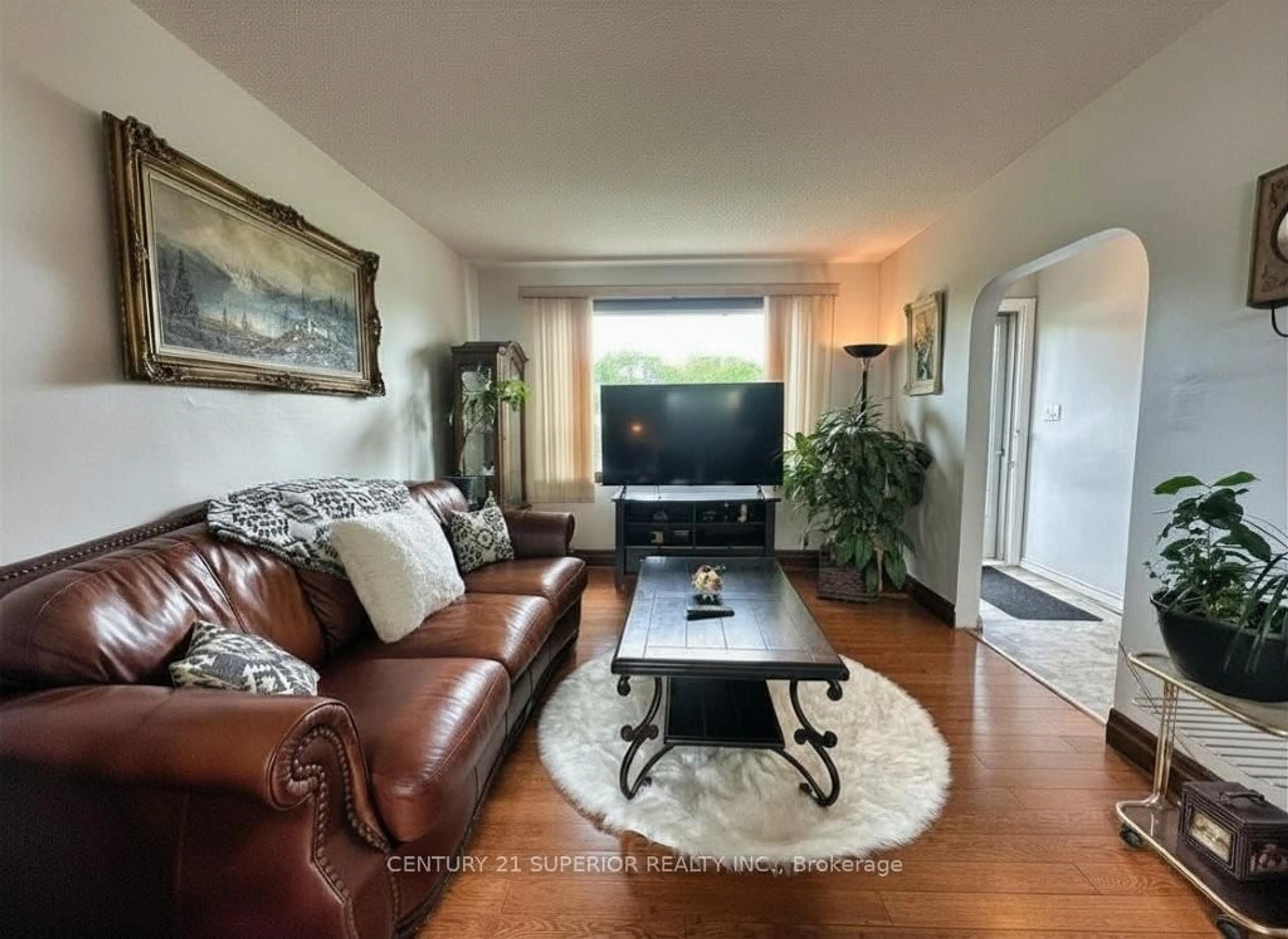 Living room with furniture, wood/laminate floor for 242 Empire Ave, Thunder Bay Ontario P7E 4R5