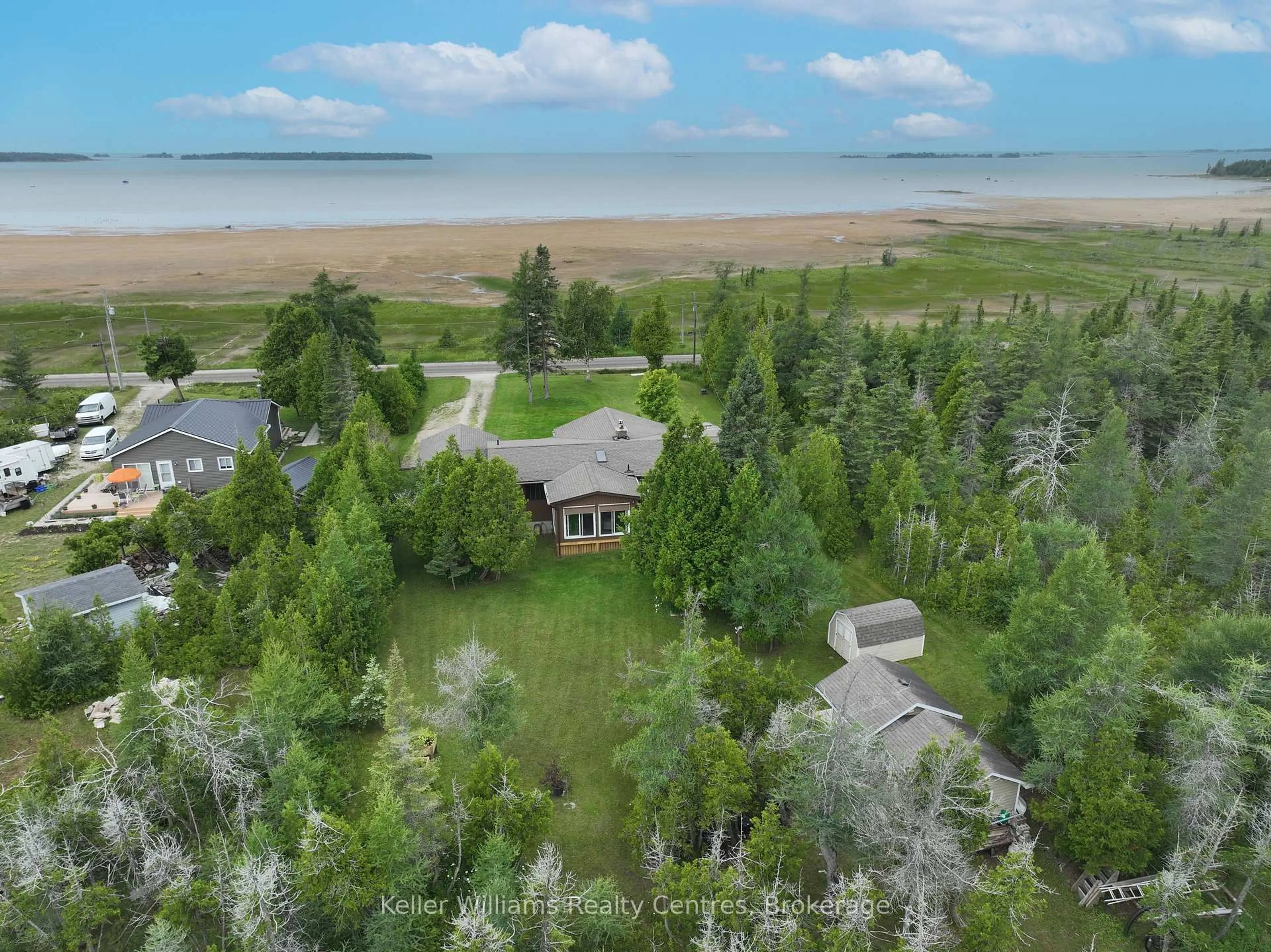 A pic from outside/outdoor area/front of a property/back of a property/a pic from drone, water/lake/river/ocean view for 453 Shoreline Ave, South Bruce Peninsula Ontario N0H 2T0