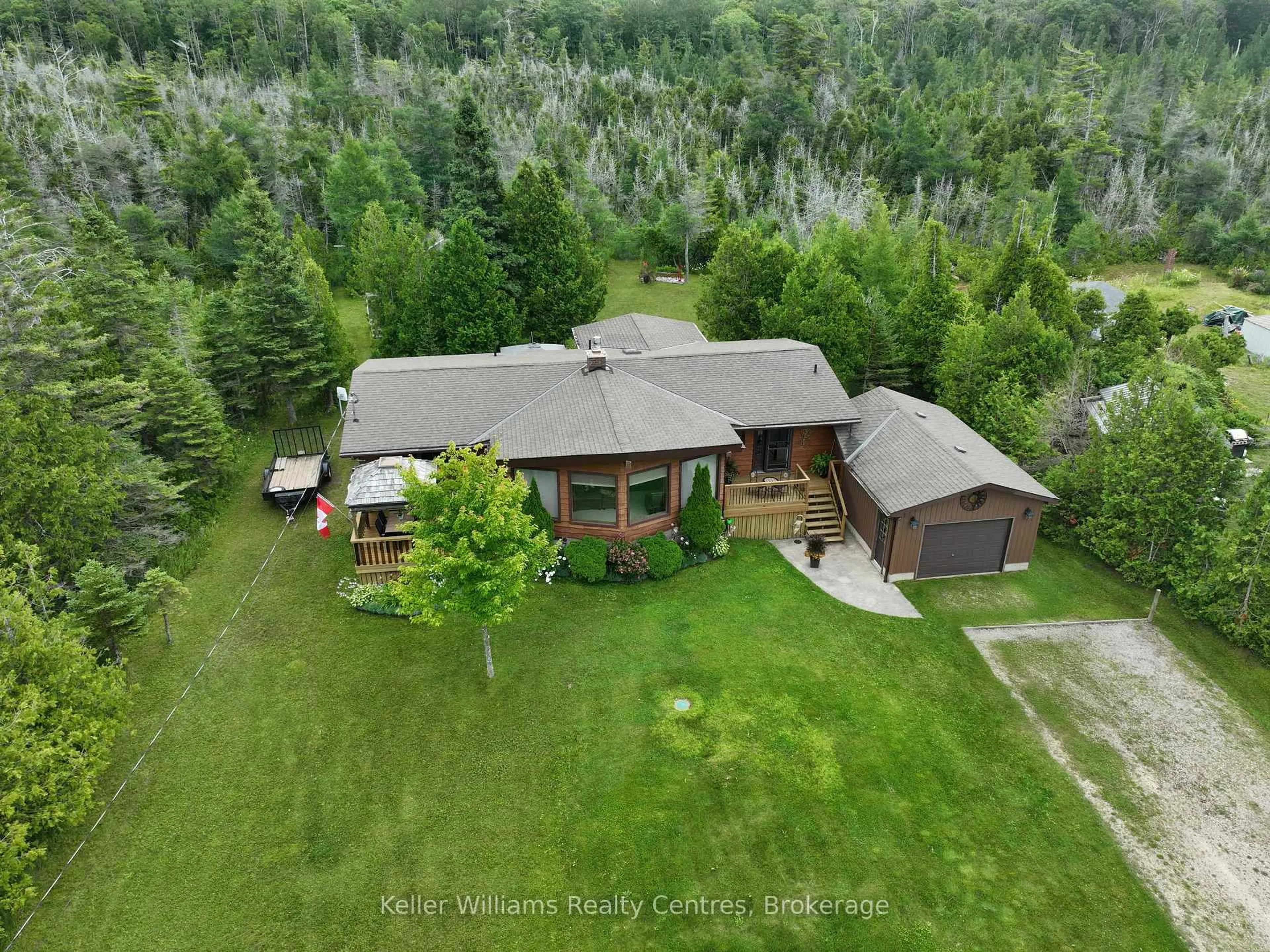 A pic from outside/outdoor area/front of a property/back of a property/a pic from drone, forest/trees view for 453 Shoreline Ave, South Bruce Peninsula Ontario N0H 2T0