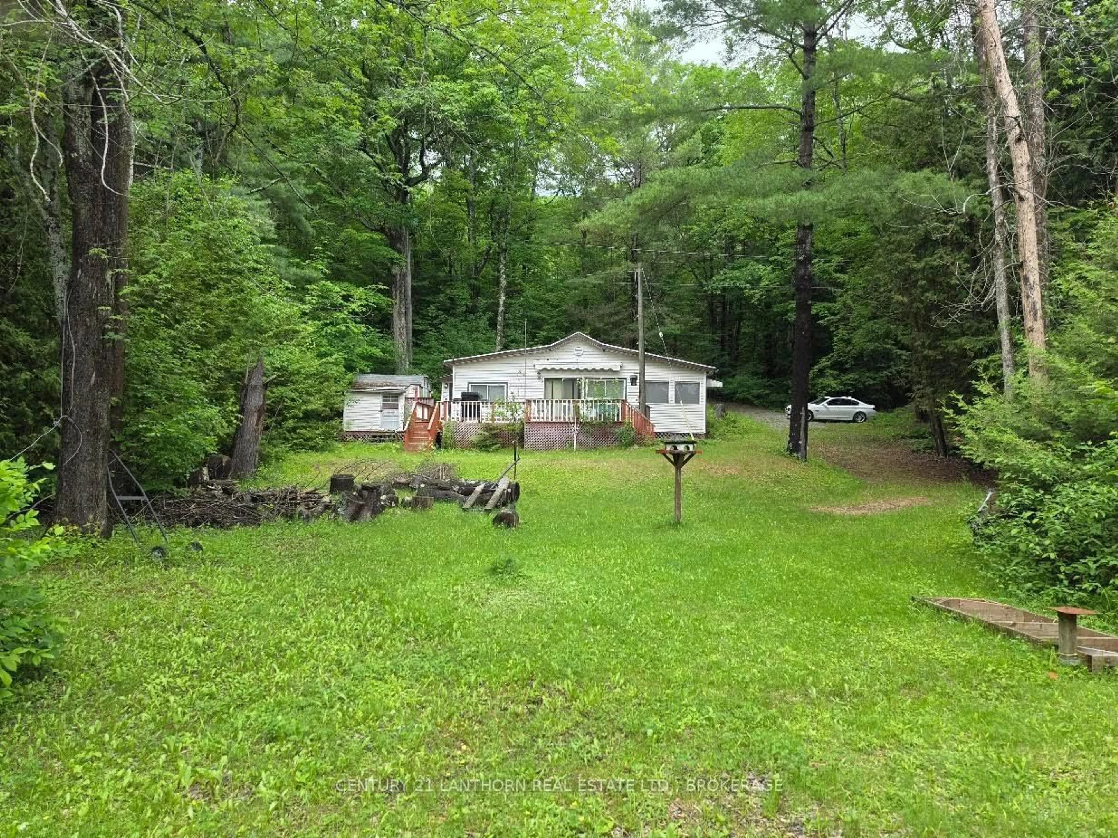 A pic from outside/outdoor area/front of a property/back of a property/a pic from drone, unknown for 1039 Big Bay Rd, Arden Ontario K0H 1B0