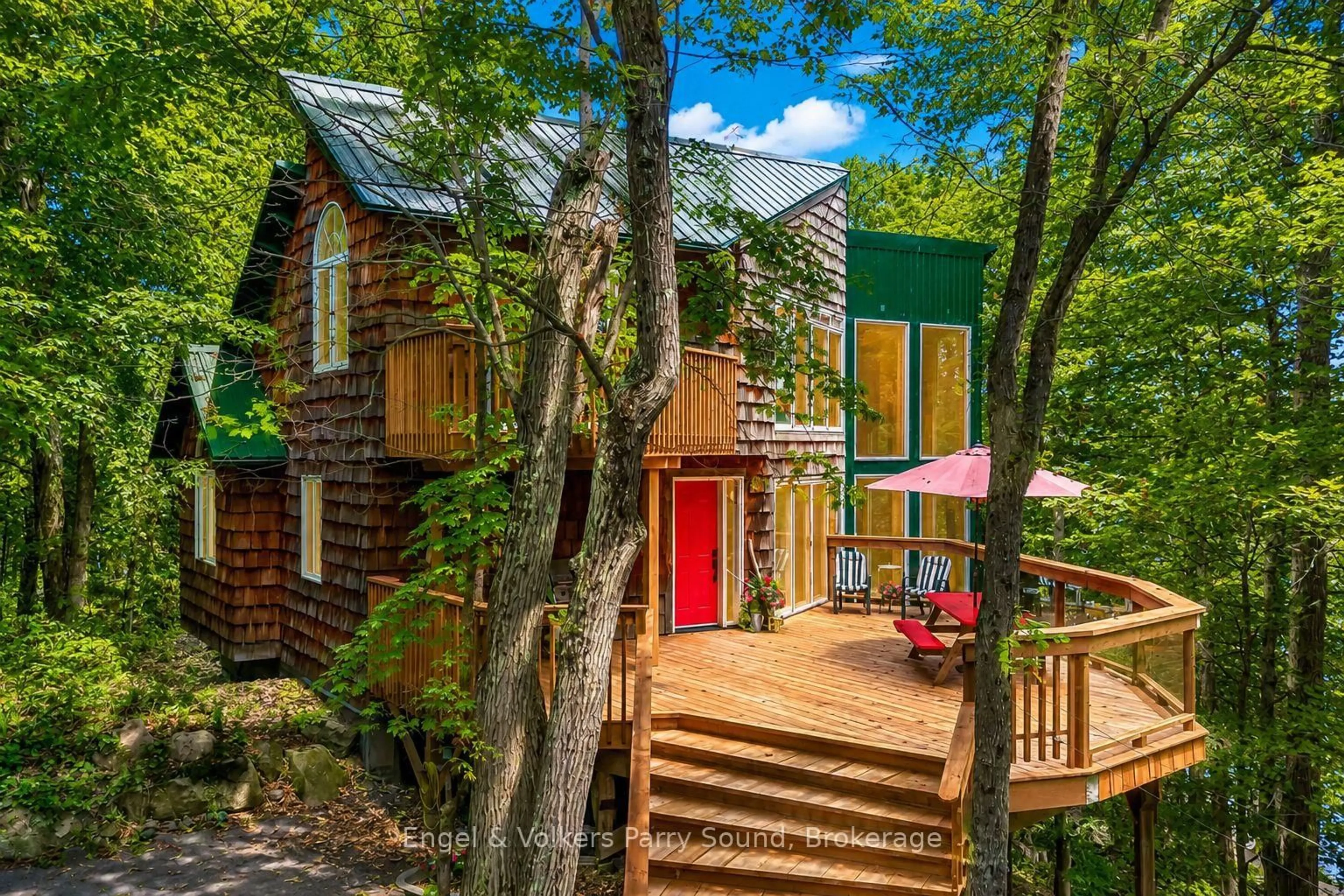 A pic from outside/outdoor area/front of a property/back of a property/a pic from drone, forest/trees view for 139 Manitou Dr, McKellar Ontario P0G 0A1