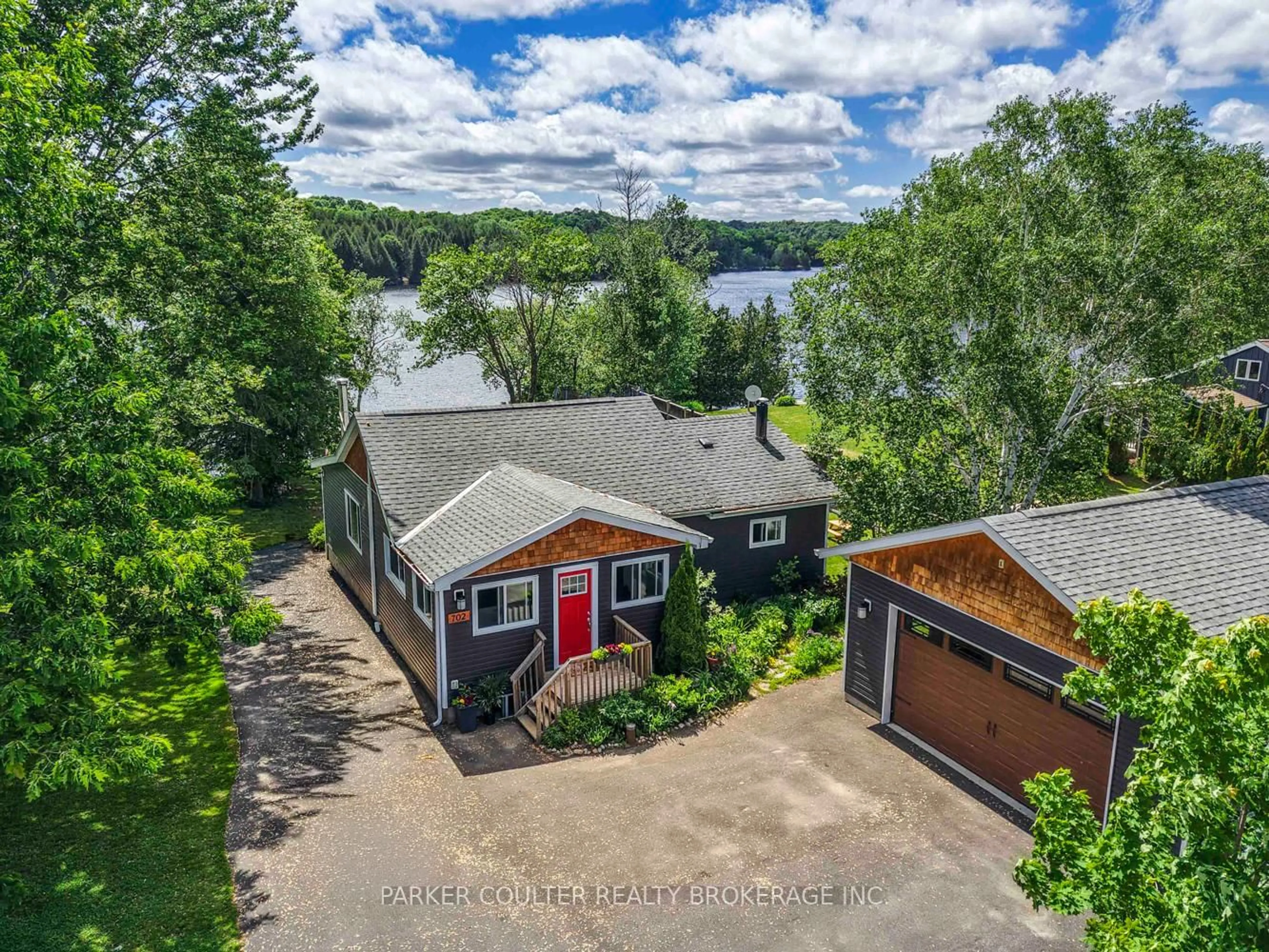 A pic from outside/outdoor area/front of a property/back of a property/a pic from drone, water/lake/river/ocean view for 702 Highway 124, McKellar Ontario P0G 1C0