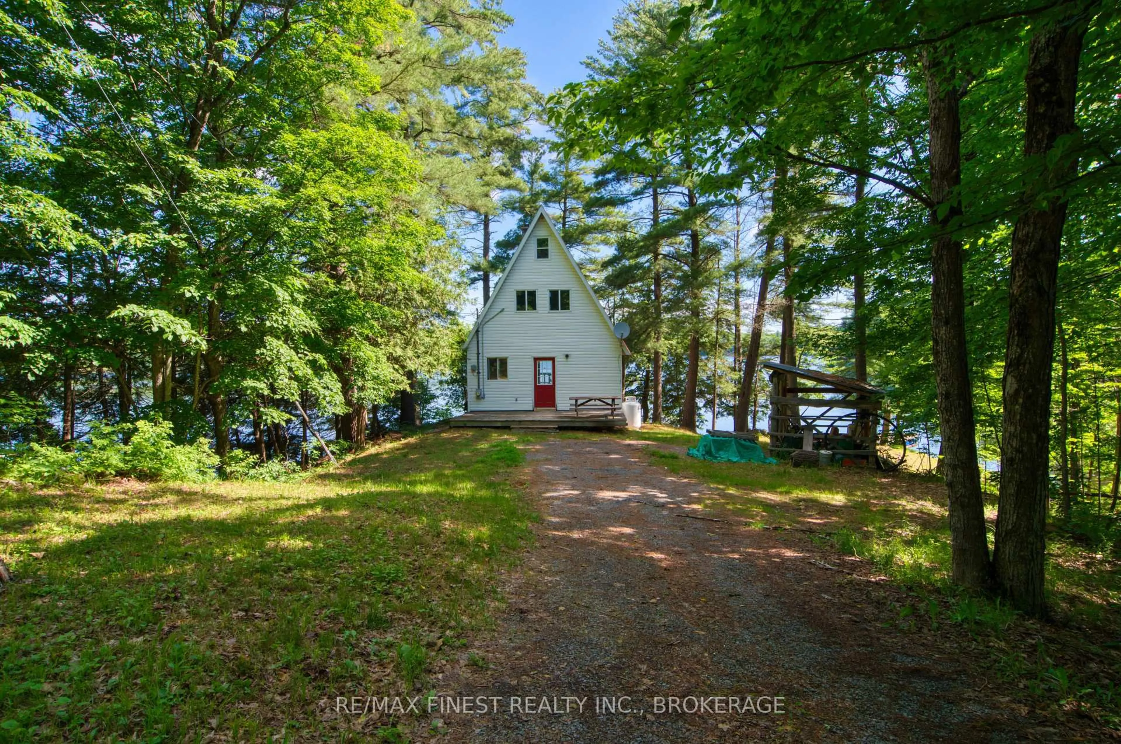 A pic from outside/outdoor area/front of a property/back of a property/a pic from drone, water/lake/river/ocean view for 1086 Salamander Lane, Sydenham Ontario K0H 2T0