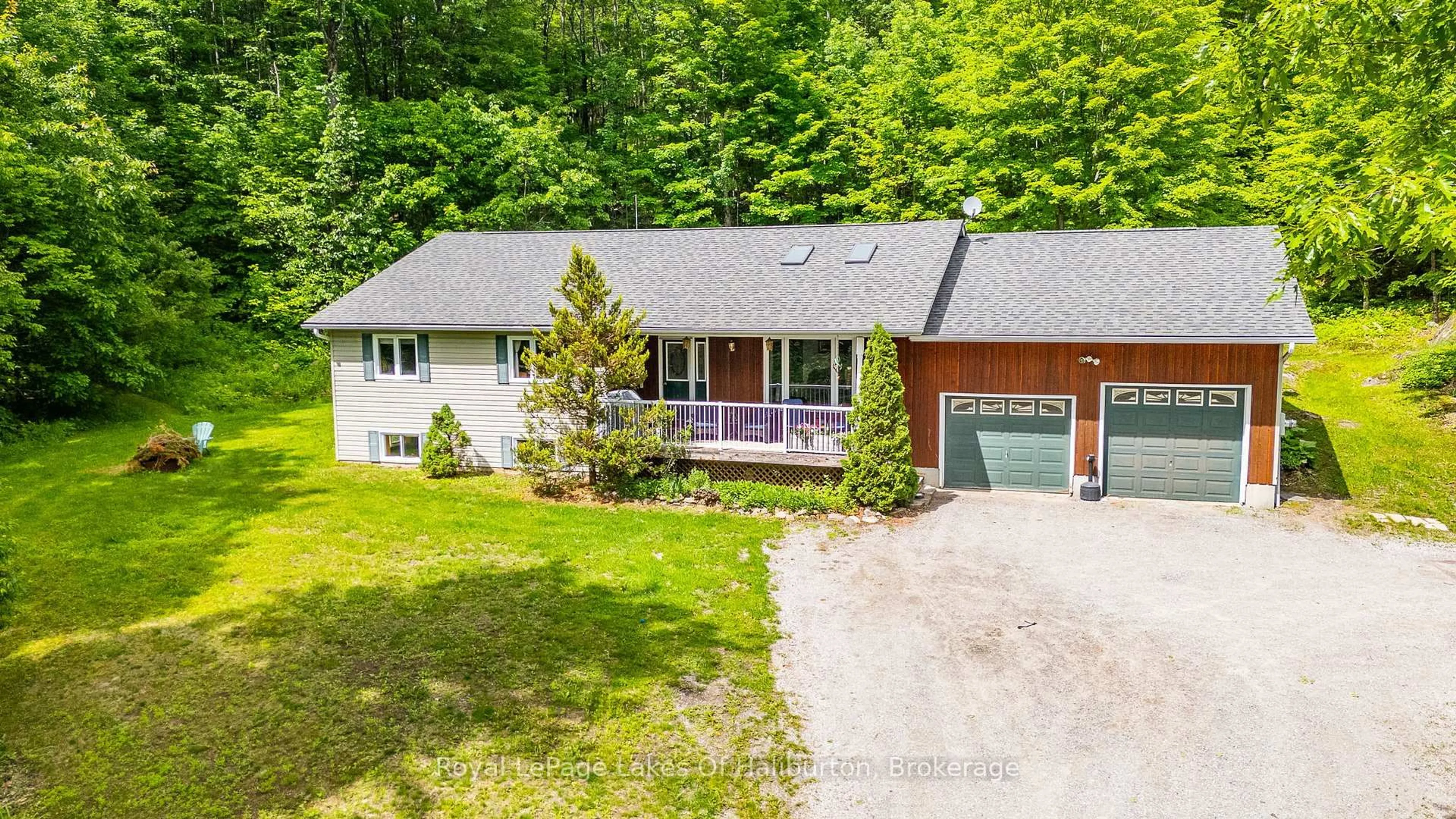 A pic from outside/outdoor area/front of a property/back of a property/a pic from drone, street for 16741 Highway 118, Dysart et al Ontario K0M 1S0