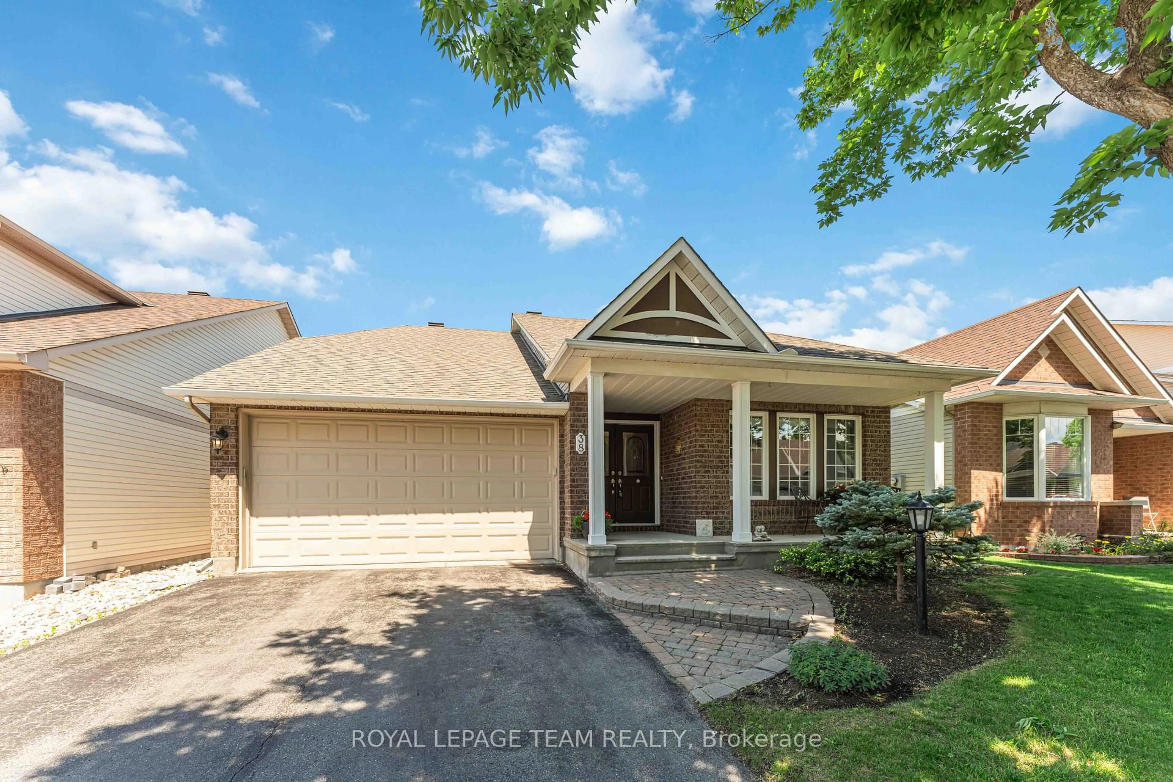 Home with brick exterior material, street for 38 Settler's Ridge Way, Ottawa Ontario K2J 4V2