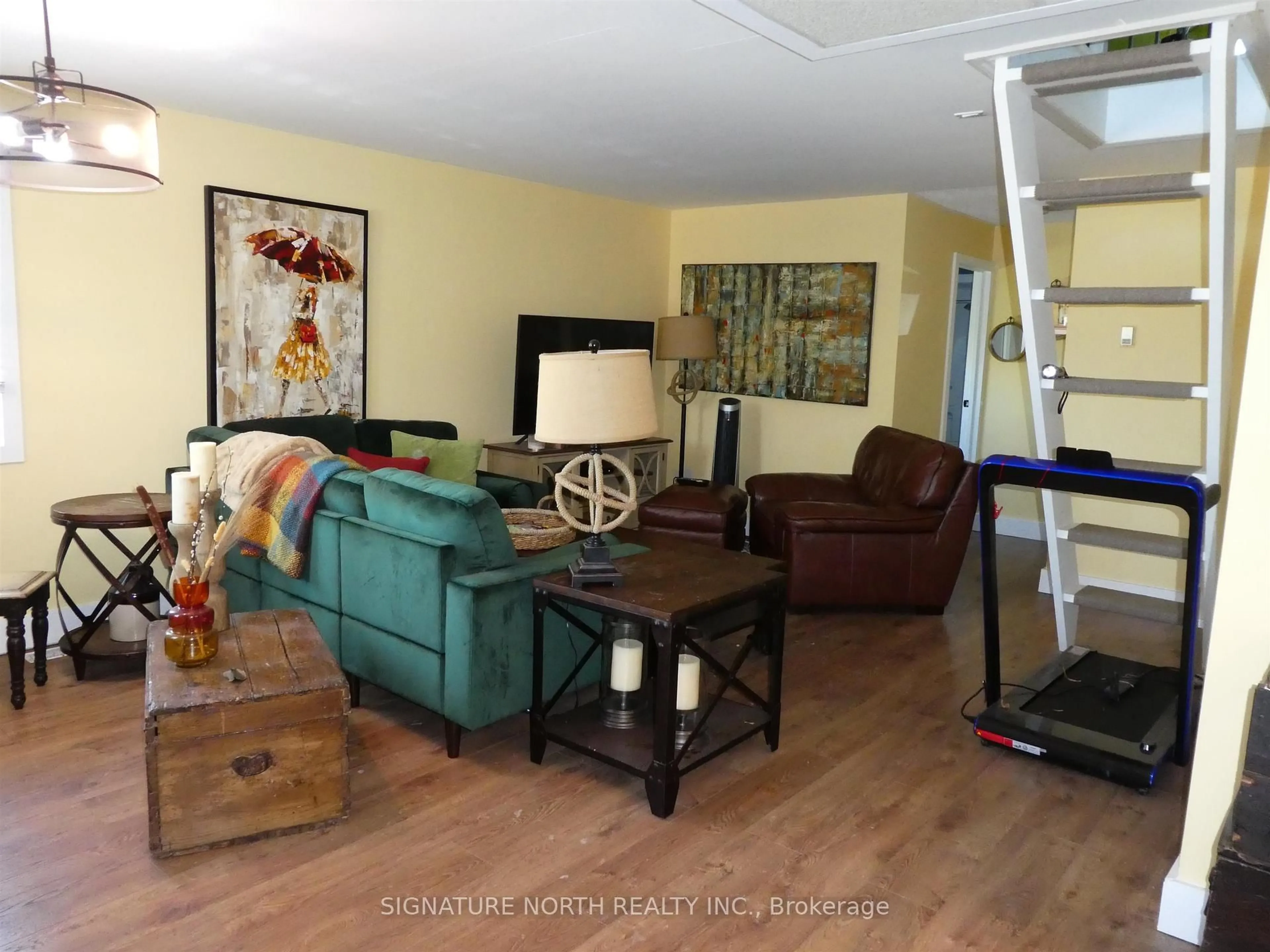Living room with furniture, wood/laminate floor for 125 Kenogami, Greenstone Ontario P0T 2A0