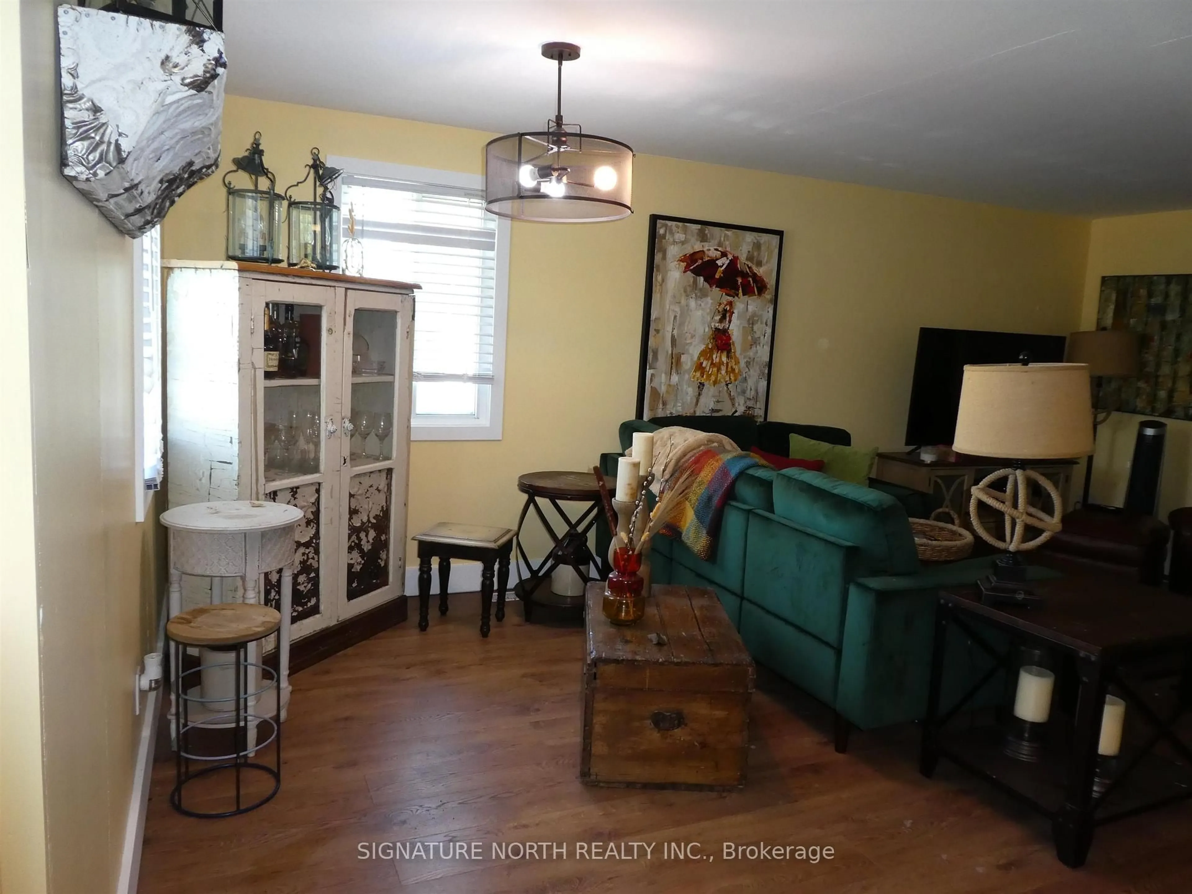 Living room with furniture, wood/laminate floor for 125 Kenogami, Greenstone Ontario P0T 2A0
