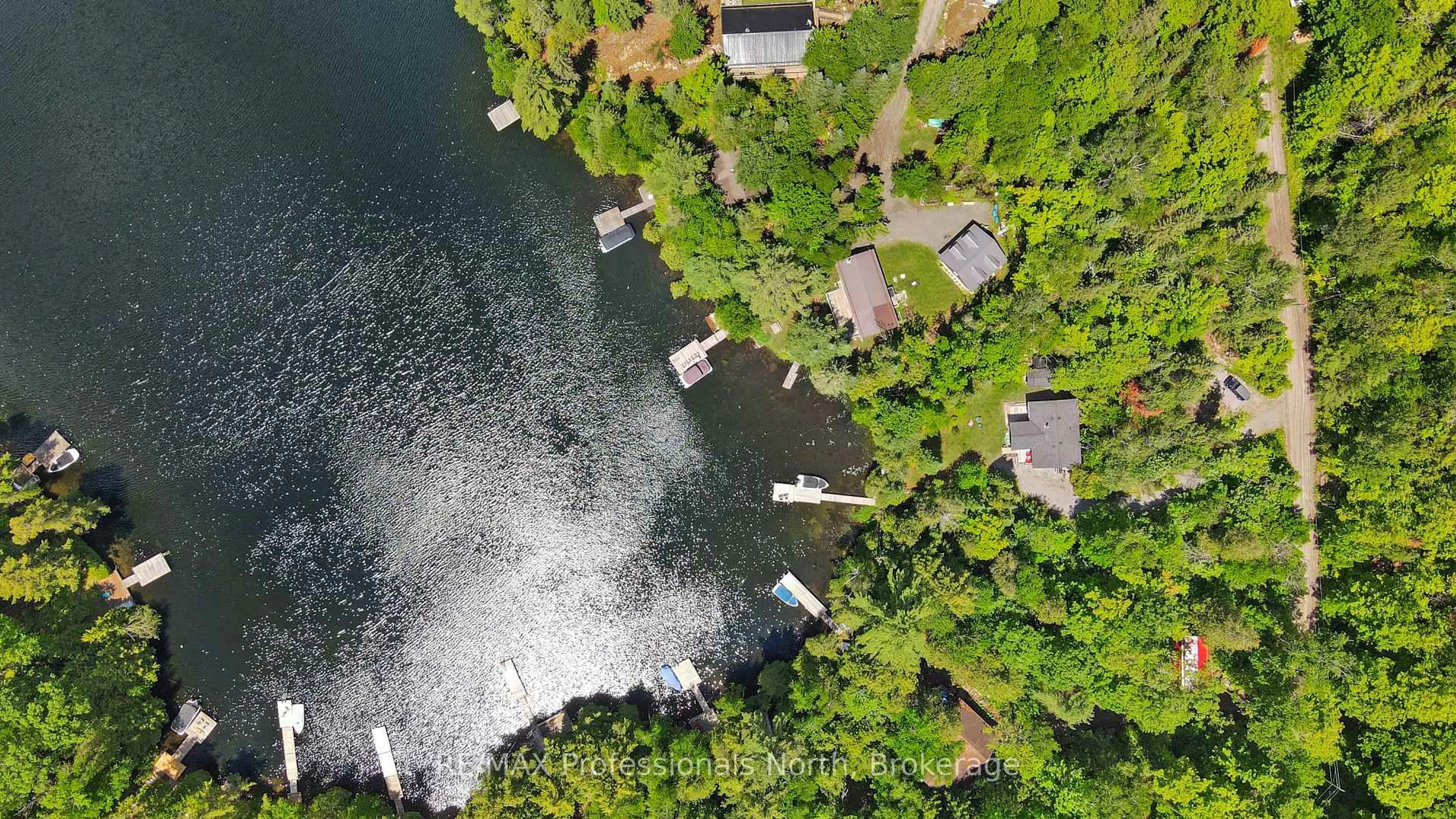 A pic from outside/outdoor area/front of a property/back of a property/a pic from drone, water/lake/river/ocean view for 1368 Grosbeak Dr, Dysart et al Ontario K0L 1M1