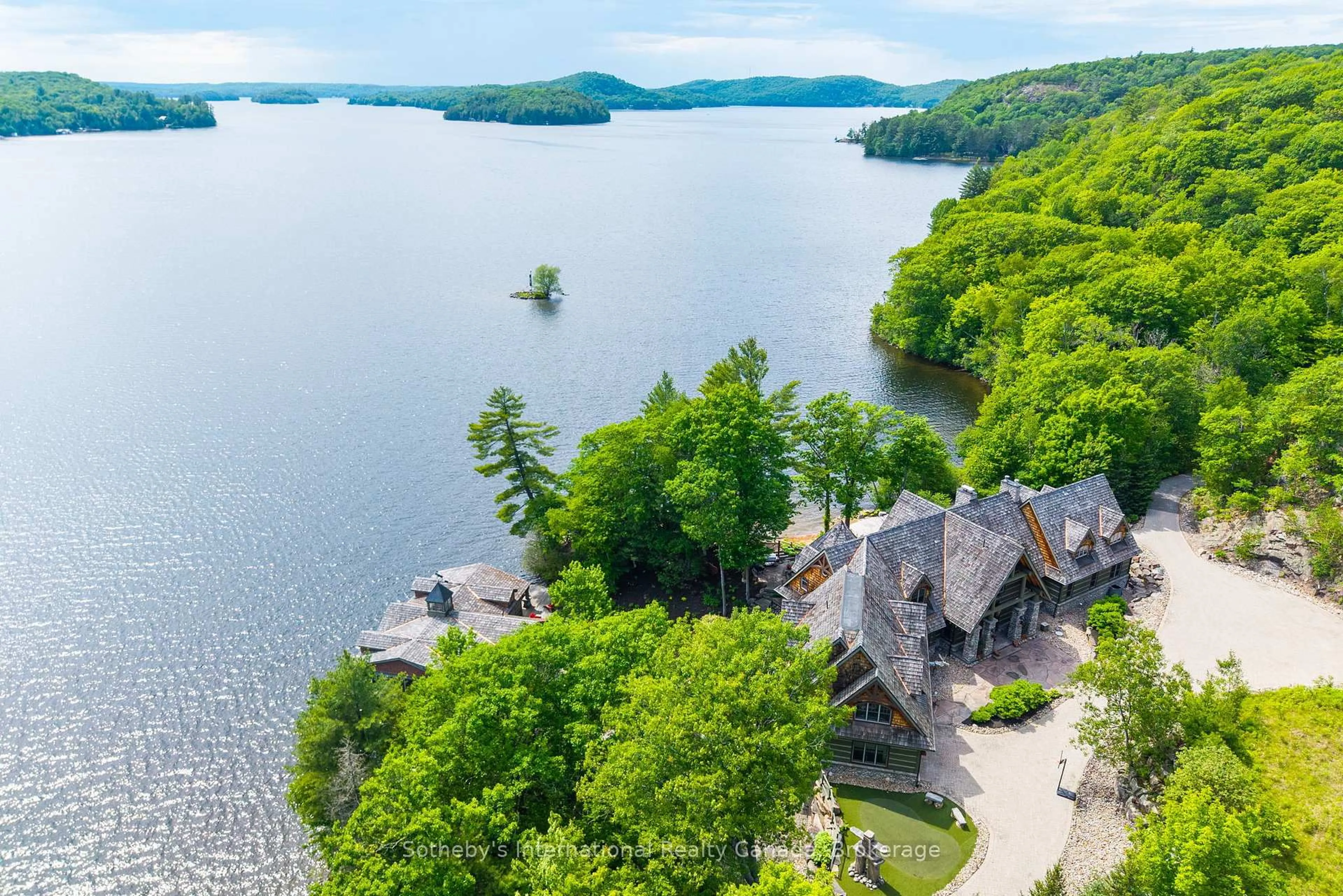 A pic from outside/outdoor area/front of a property/back of a property/a pic from drone, water/lake/river/ocean view for 1100 Delbrooke Rd #2, Lake of Bays Ontario P0A 1H0
