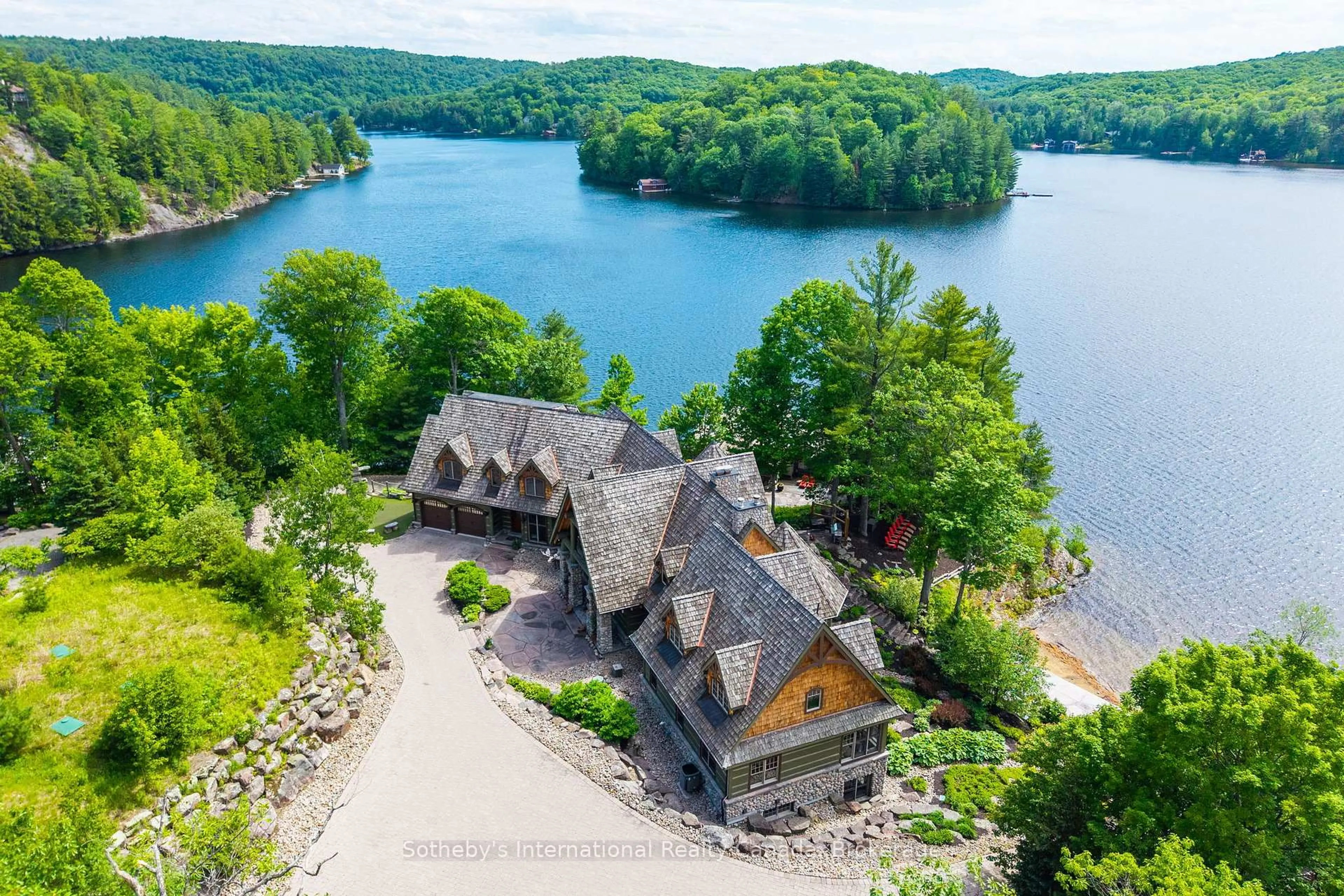 A pic from outside/outdoor area/front of a property/back of a property/a pic from drone, water/lake/river/ocean view for 1100 Delbrooke Rd #2, Lake of Bays Ontario P0A 1H0