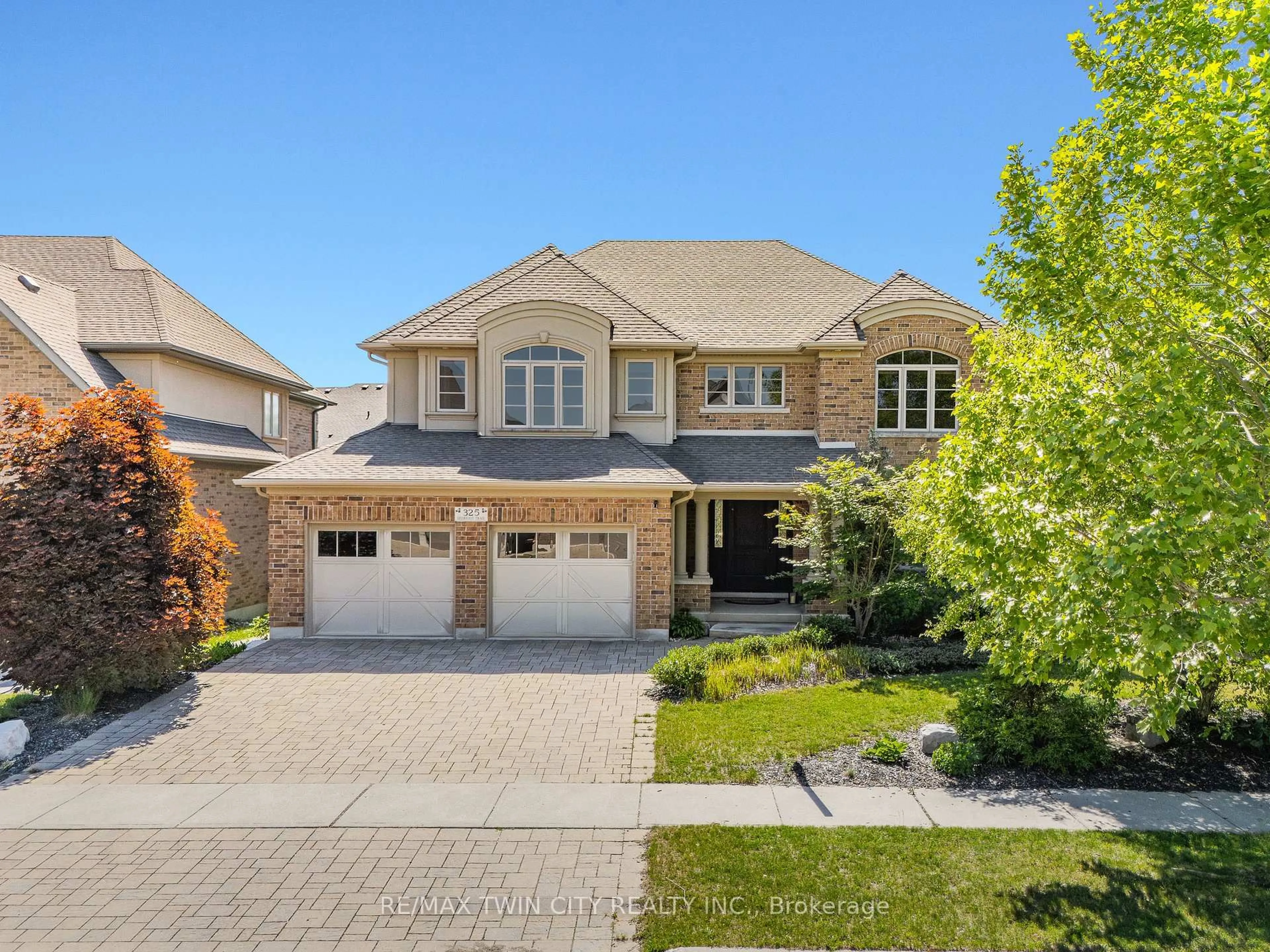 Home with brick exterior material, street for 325 Deerfoot Tr, Waterloo Ontario N2K 0B4